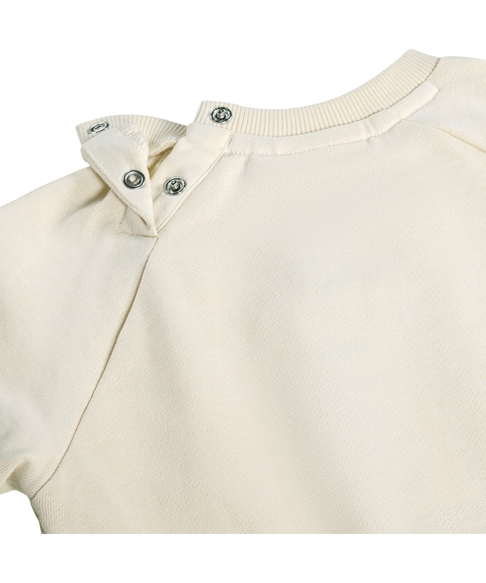 Disc - Little Rainbow - Blød, cremefarvet sweatshirt med regnbueprint i økologisk bomuld til baby 