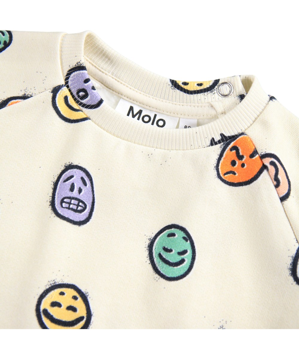 Disc - Multi Moods - Råhvid sweatshirt til de mindste i blødt økologisk bomuld med et med farverigt print af ansigter i forskelligt humør.