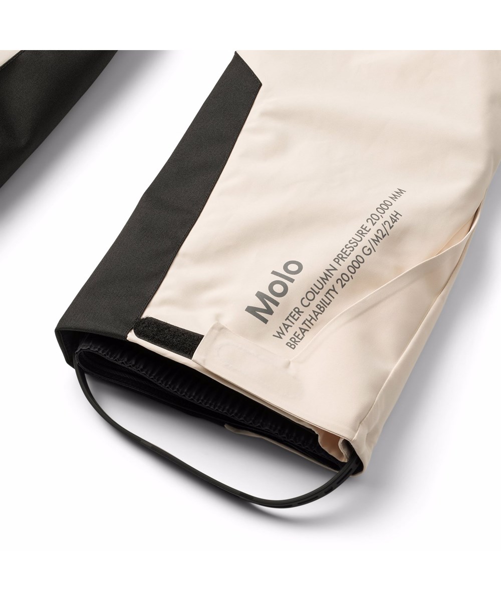 Jump Pro - Vanilla - Gebroken witte wind- en waterdichte kinderskibroek gemaakt van gerecycled polyester en gevoerd met 3M™ Thinsulate™.