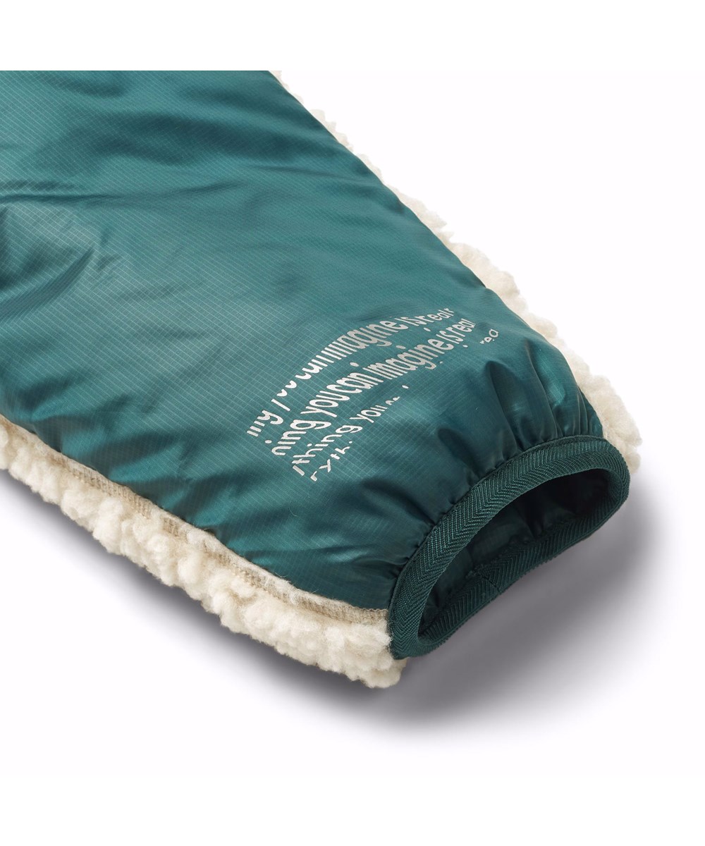 Ugo - Ponderosa Pine - Omkeerbaar fleecejas voor kinderen in donkergroen en gebroken wit.