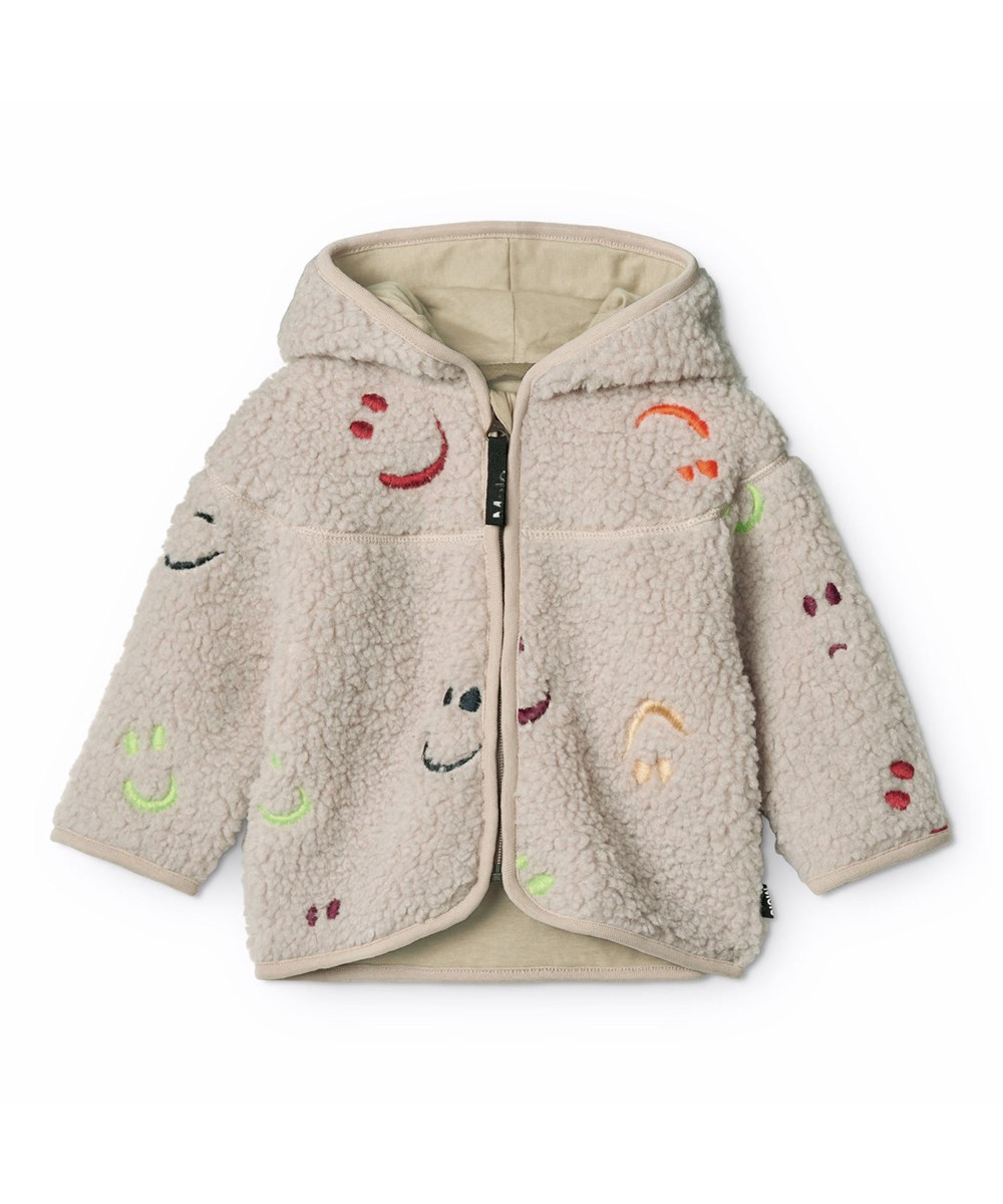Ummi - Teddy Emotions - Beige fleecejas voor de kleintjes gemaakt van gerecycled polyester met kleurrijke geborduurde lachende gezichtjes.