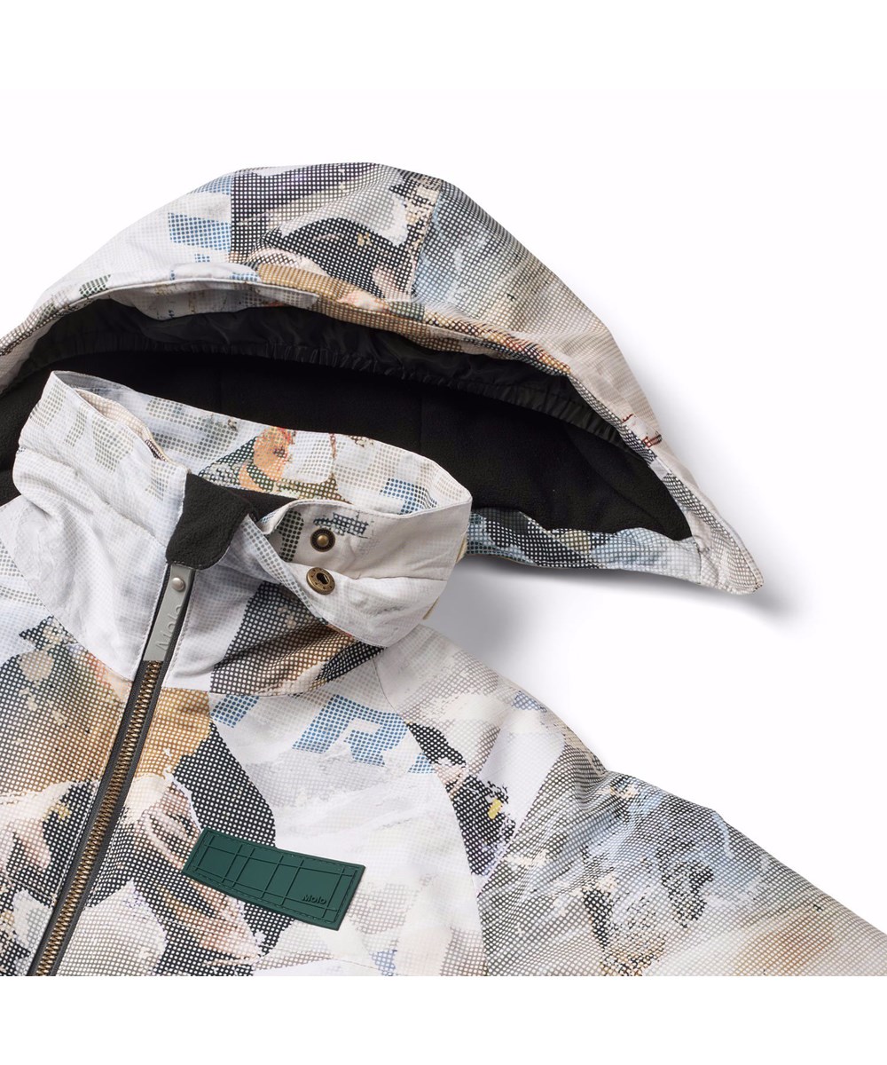 Castor - Spin 1260 - Wind- en waterdichte winterjas voor kinderen van gerecycled polyester met een pixelprint van een stoere snowboarder in de Alpen.