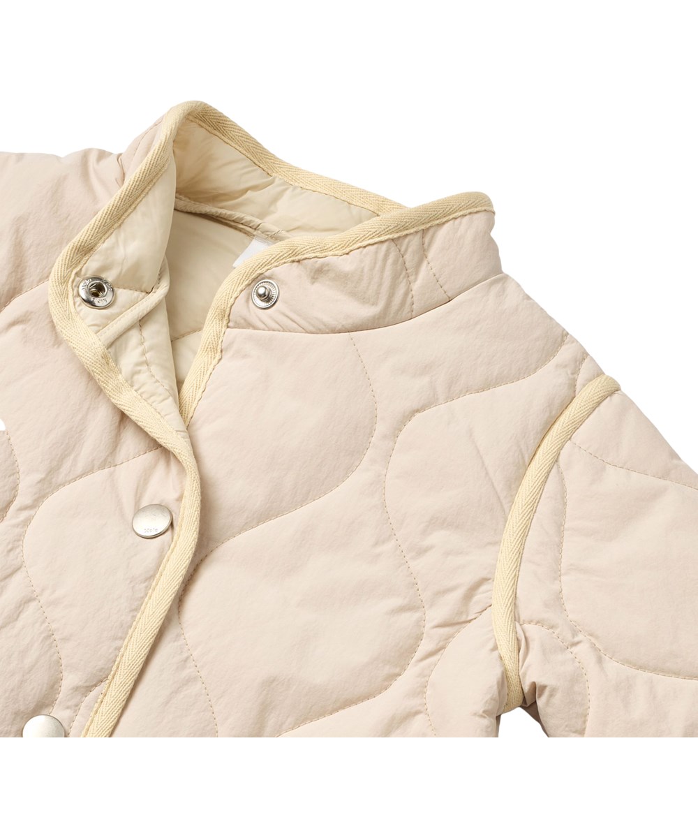 Harrie - Soft Powder - Beige waterafstotende thermojas gemaakt van gerecycled nylon met gewatteerd patroon voor kinderen