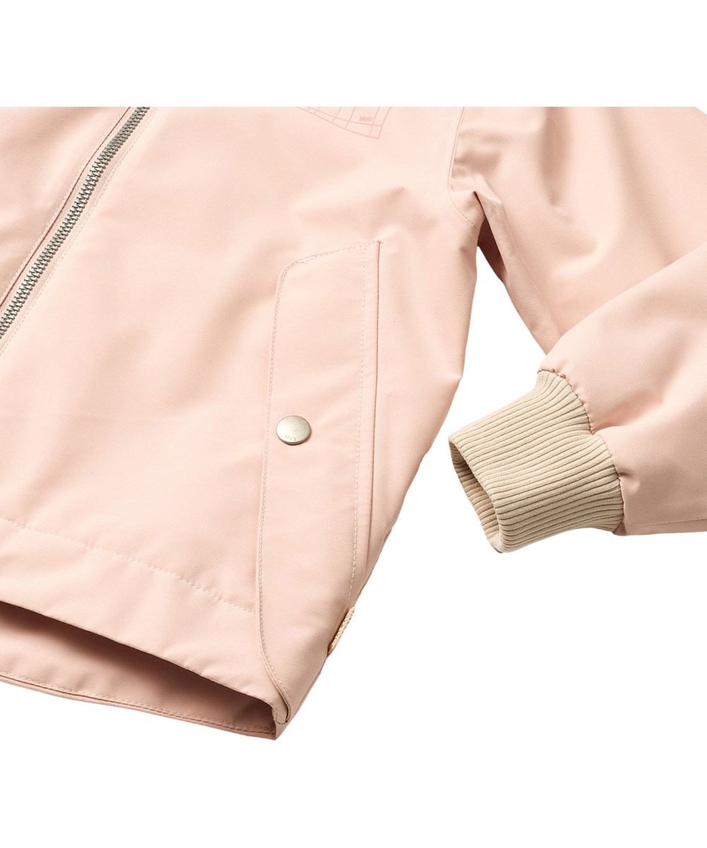 Hoplas - Petal Blush - Wind- en waterdichte lichtroze jas voor kinderen gemaakt van gerecycled polyester.