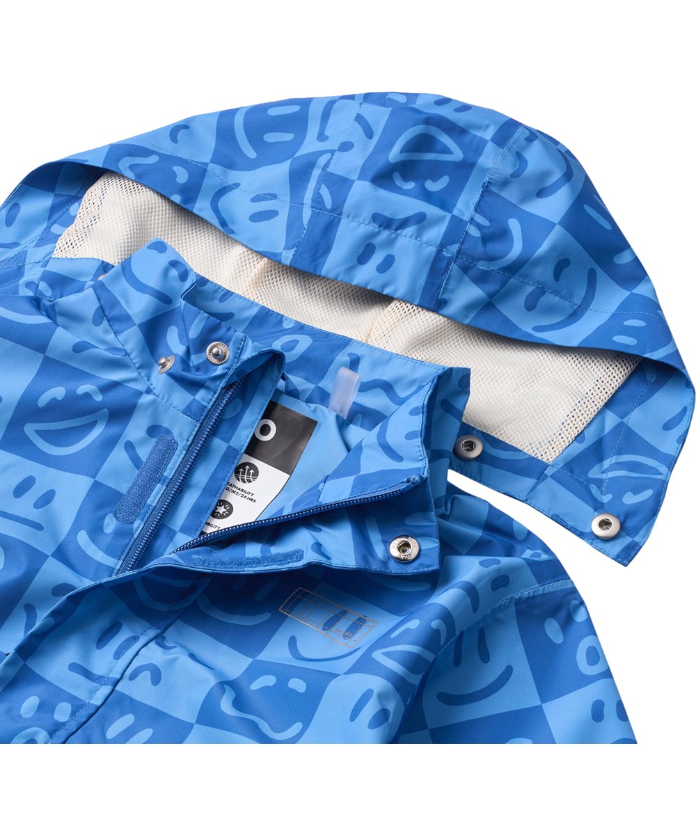 Waiton - Vibe Checks BLU - Wind- en waterdichte regenjas gemaakt van gerecycled polyester. De jas is in blauwtinten met een geruite print van verschillende emoji's.