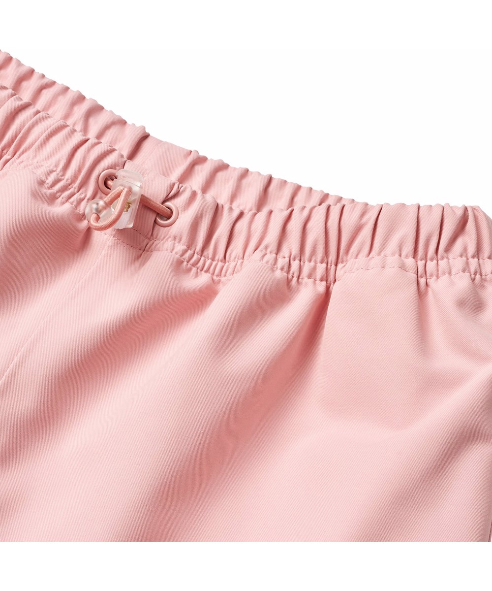 Waits - Rosequartz - Roze wind- en waterdichte regenbroek voor kinderen met duurzaam en gerecycled polyester.