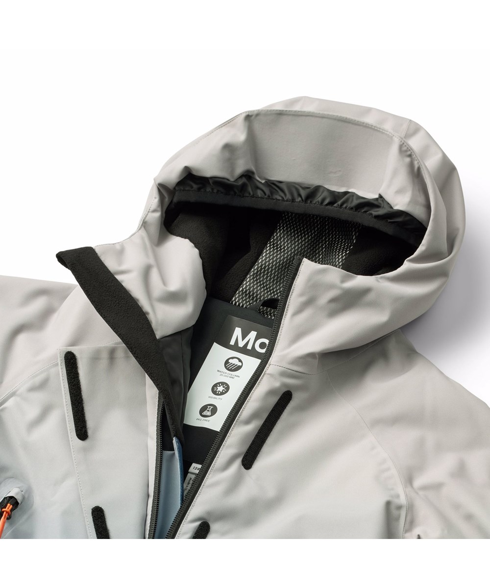 Hux - Blue Ice - Wind- en waterdichte skipak voor een kouden winter of skivakantie in blauwe kleurovergangen gemaakt van gerecycled polyester en gevoerd met 3M™ Thinsulate™.