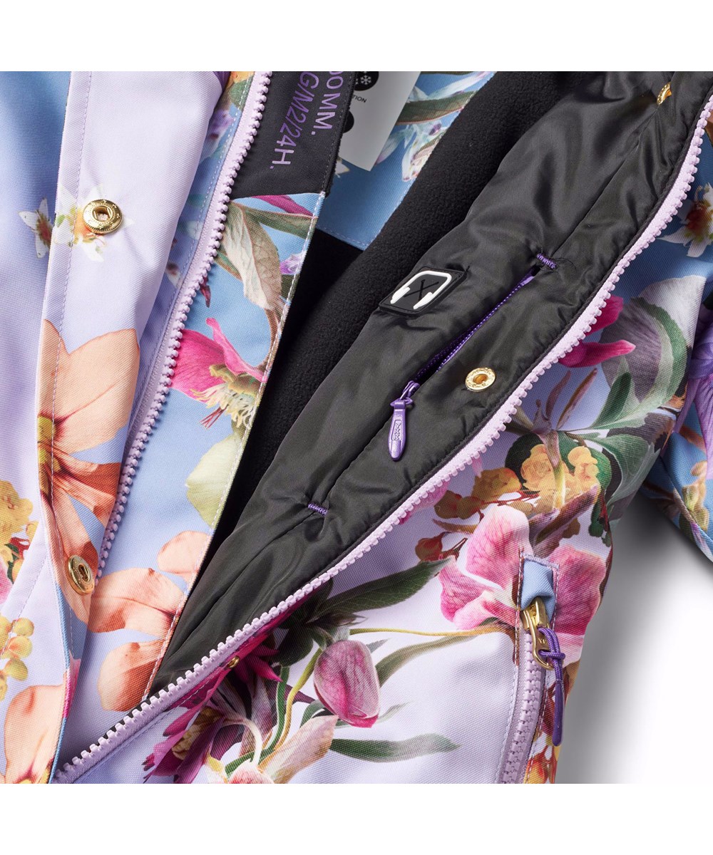 Hux - Gradient Bloom - Blauwe en paarse kinder skipak gemaakt van gerecycled polyester met een bloemenprint.