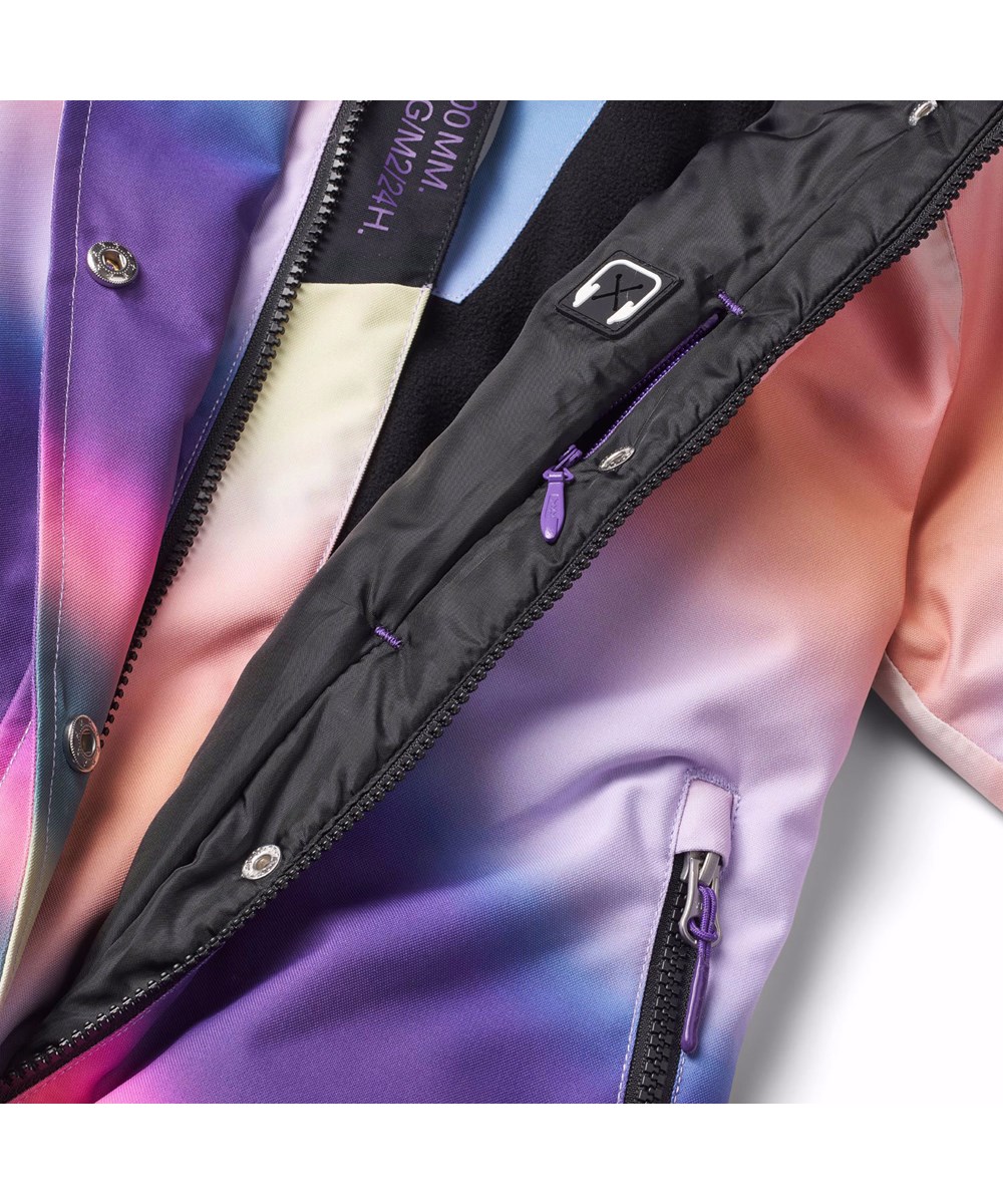 Hux - Wavy Rainbow - Kinder skipak gemaakt van gerecycled polyester met een kleurrijke overlopende graffiti print.