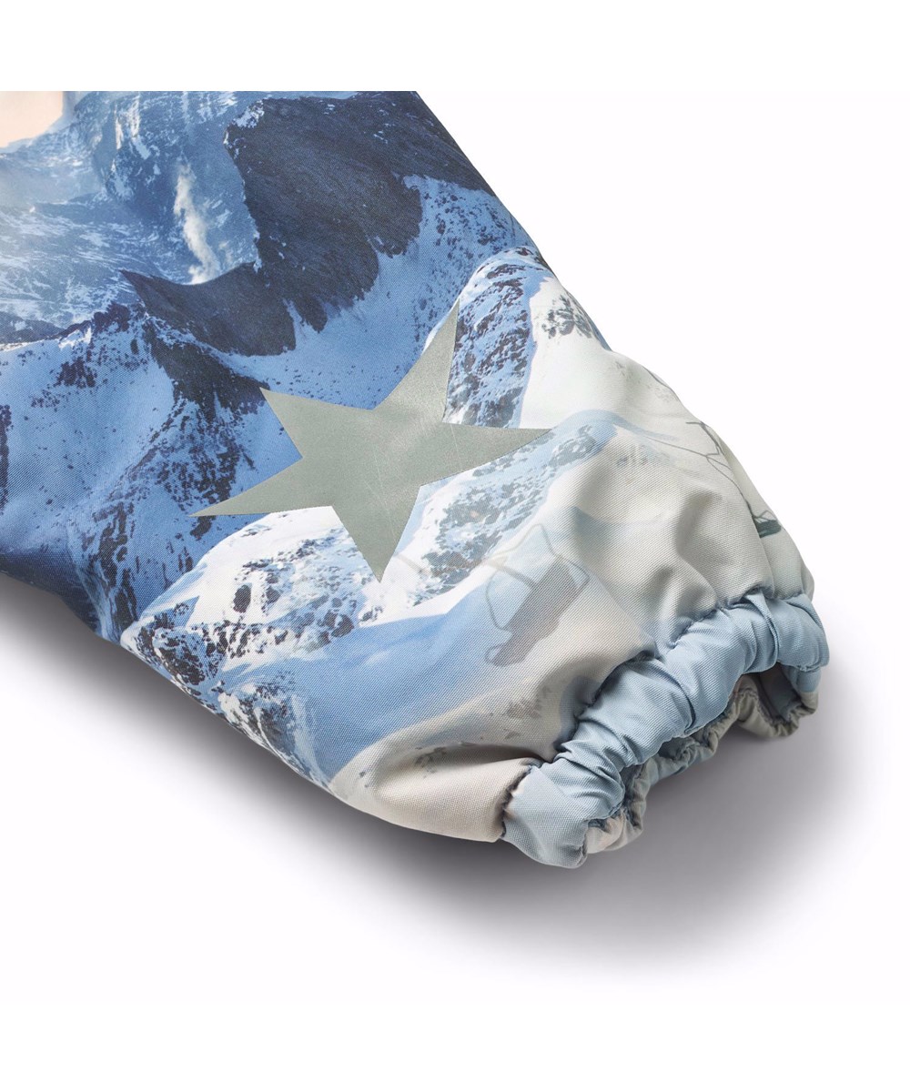 Hyde - Mountain High - Praktische winterlaarzen voor kinderen met een stevige en antislip zwarte zool en een print van schattige konijntjes tussen sneeuwklokjes op een grijze achtergrond.