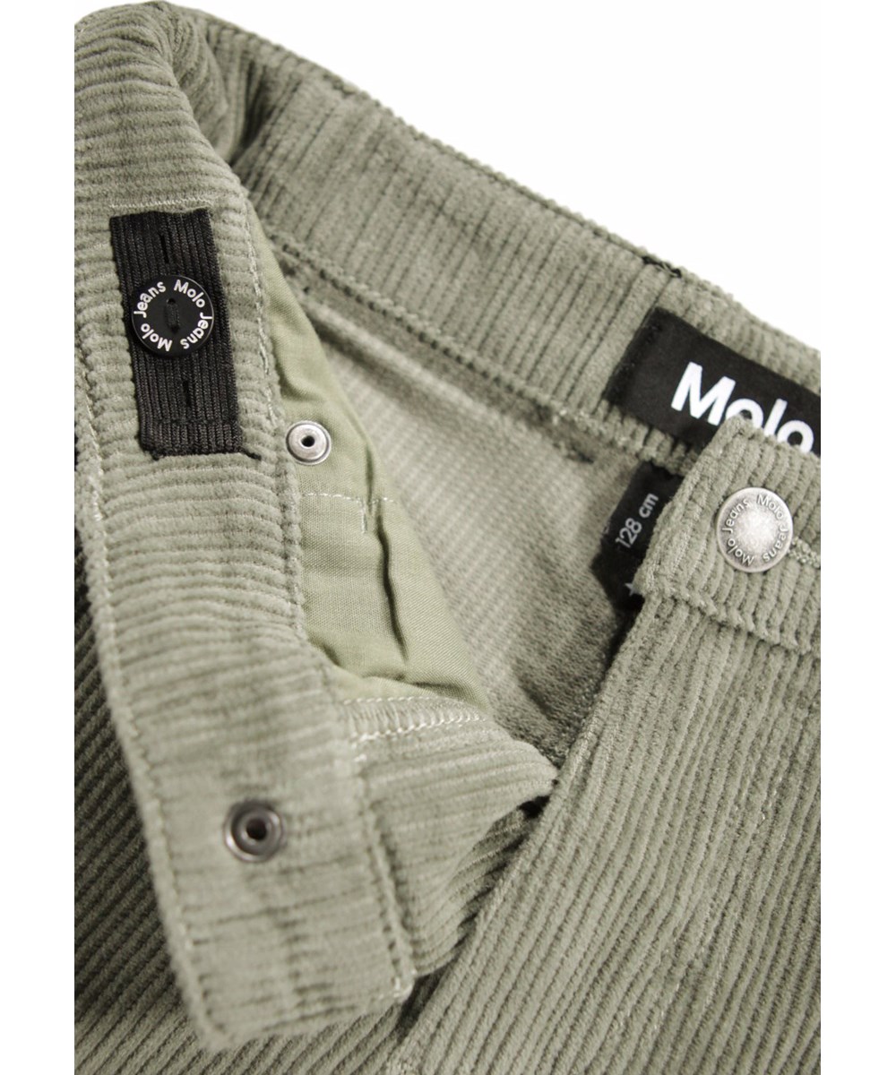 Aiden - Forest Fog - Oversized dark green pants for children made of ribbed corduroy with five pockets, wide legs and zip fly.