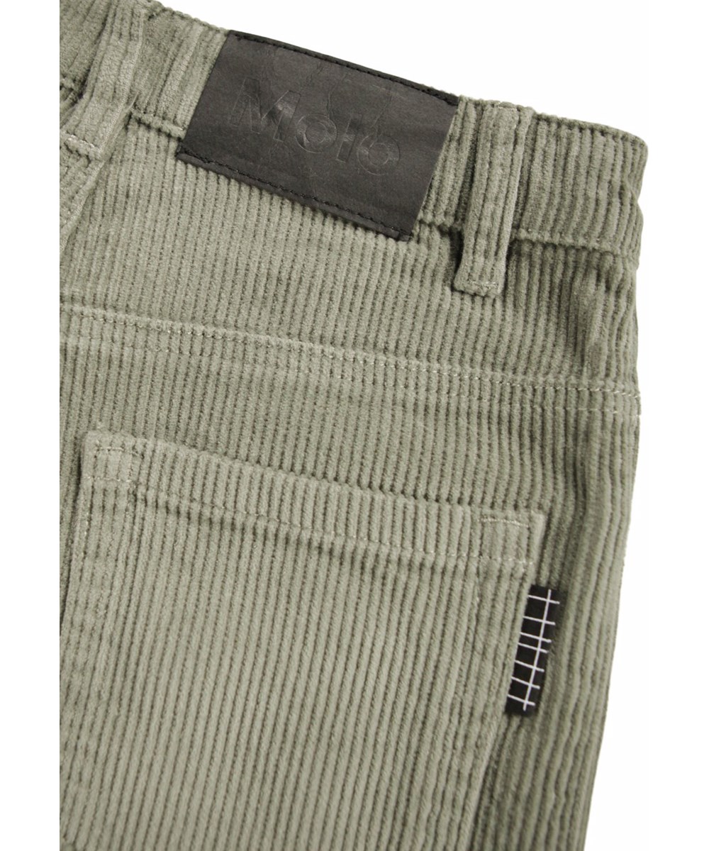 Aiden - Forest Fog - Oversized dark green pants for children made of ribbed corduroy with five pockets, wide legs and zip fly.