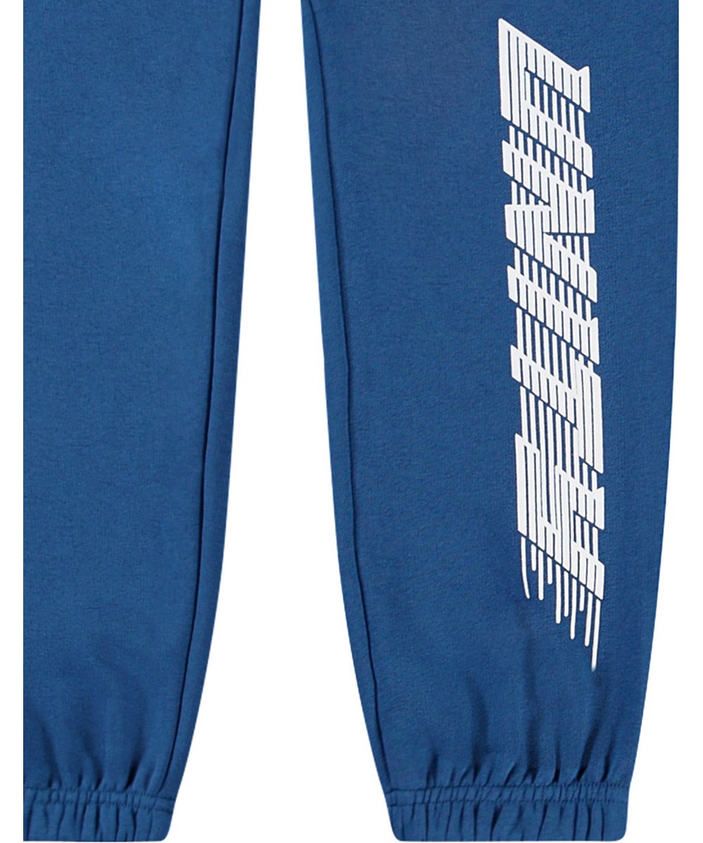 Allen - Best Blue - Blue organic pants with 'Unity' print for children.