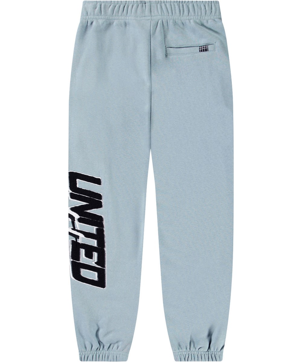 Allen - Misty Blue - Light blue organic cotton pants with 'United Future' print for children.