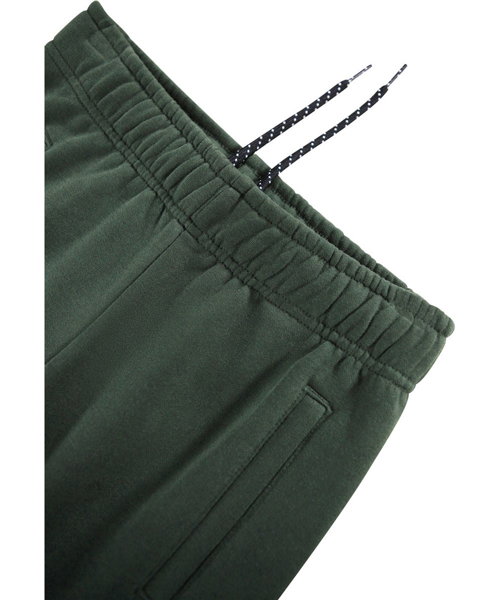 Allen - By Hands - Green sweatpants for children made of organic cotton.