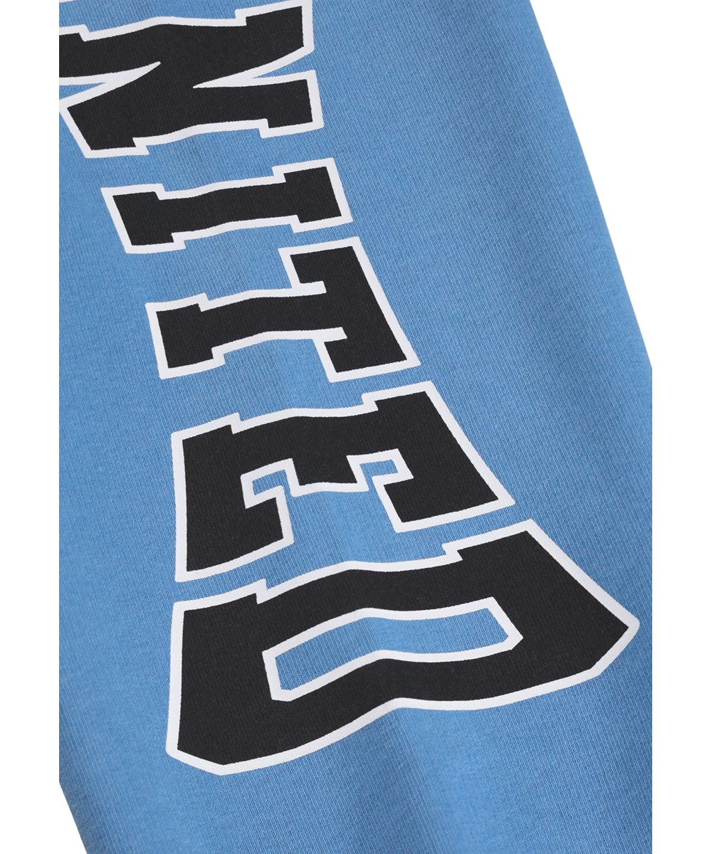 Allen - Blue Tide - Blue sweatpants for children made of soft cotton with a print