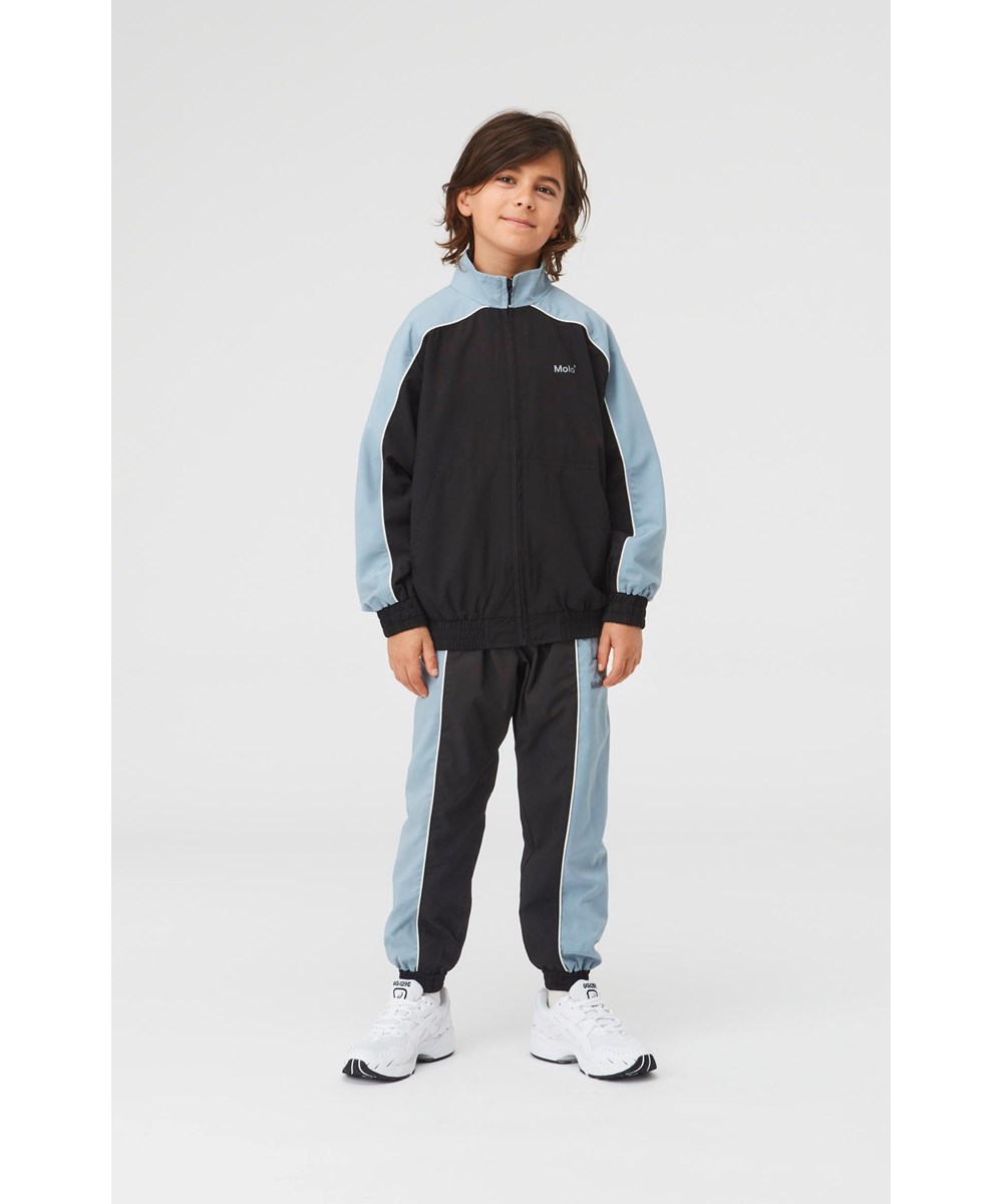 Alyxo - Aero - Black track pants with light blue sides