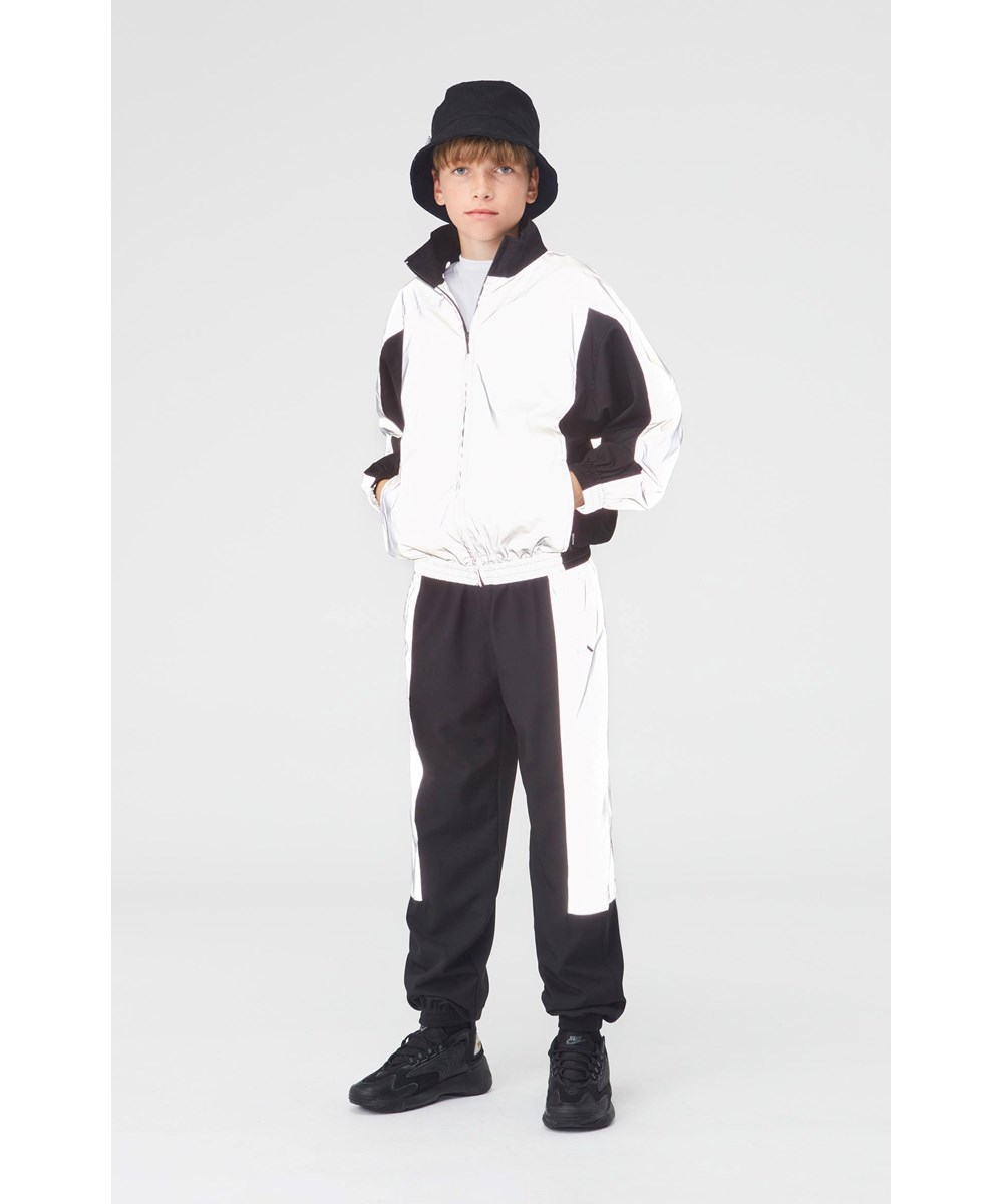 Amaz - Black - Sporty black trousers with reflective silver sides