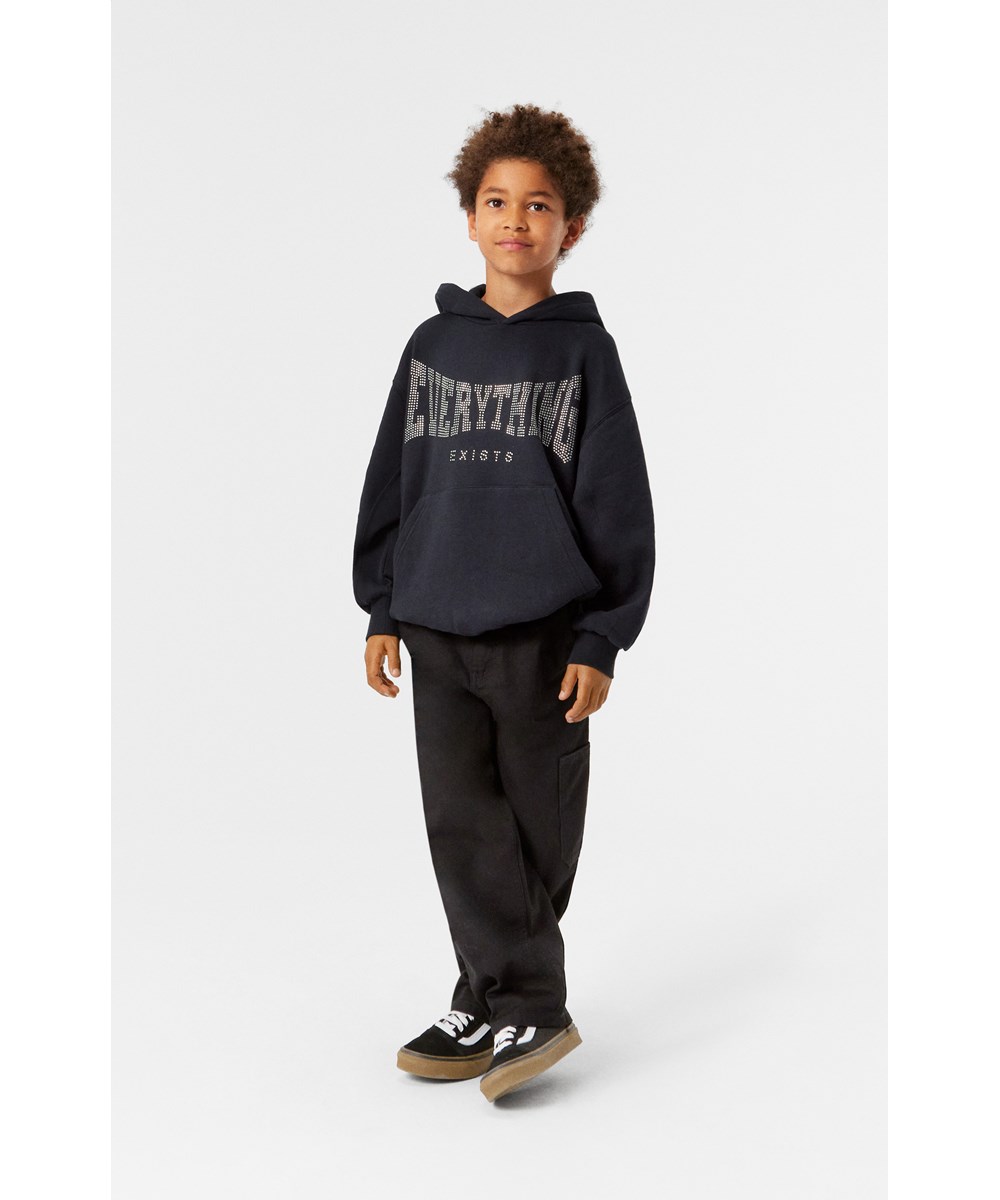 Archer - Black - Black denim jeans with loose fit and workwear details.