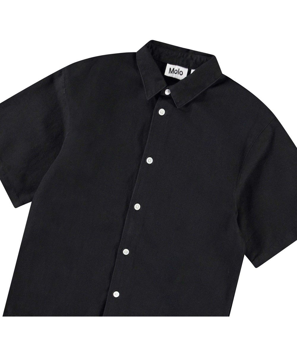 Richie - Black - Oversized black linen shirt with wide t-shirt sleeves, classic shirt collar, and button fastening at the front.