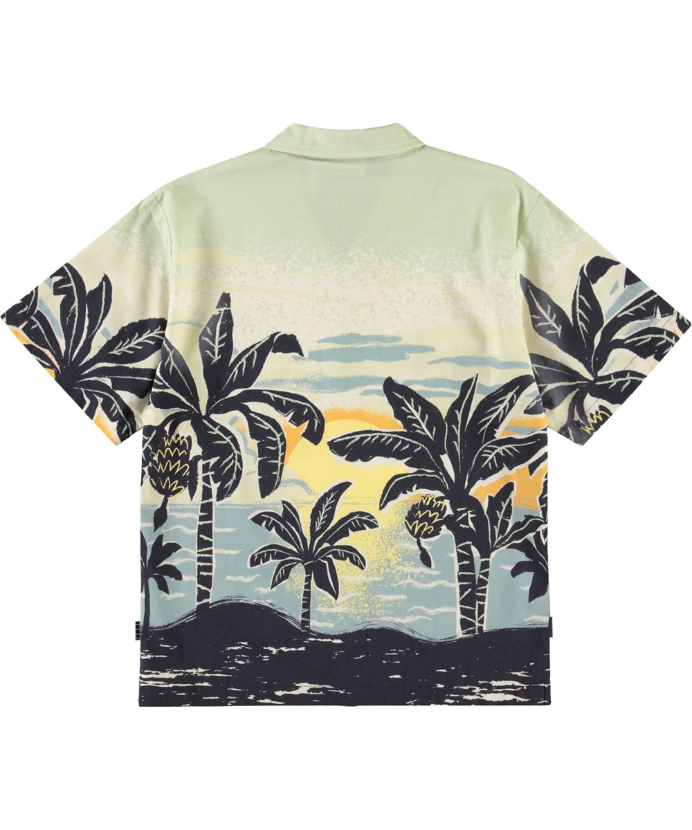 Rui - Banana Beach - Short-sleeved oversized white shirt for children in organic cotton with collar and buttons on the front.