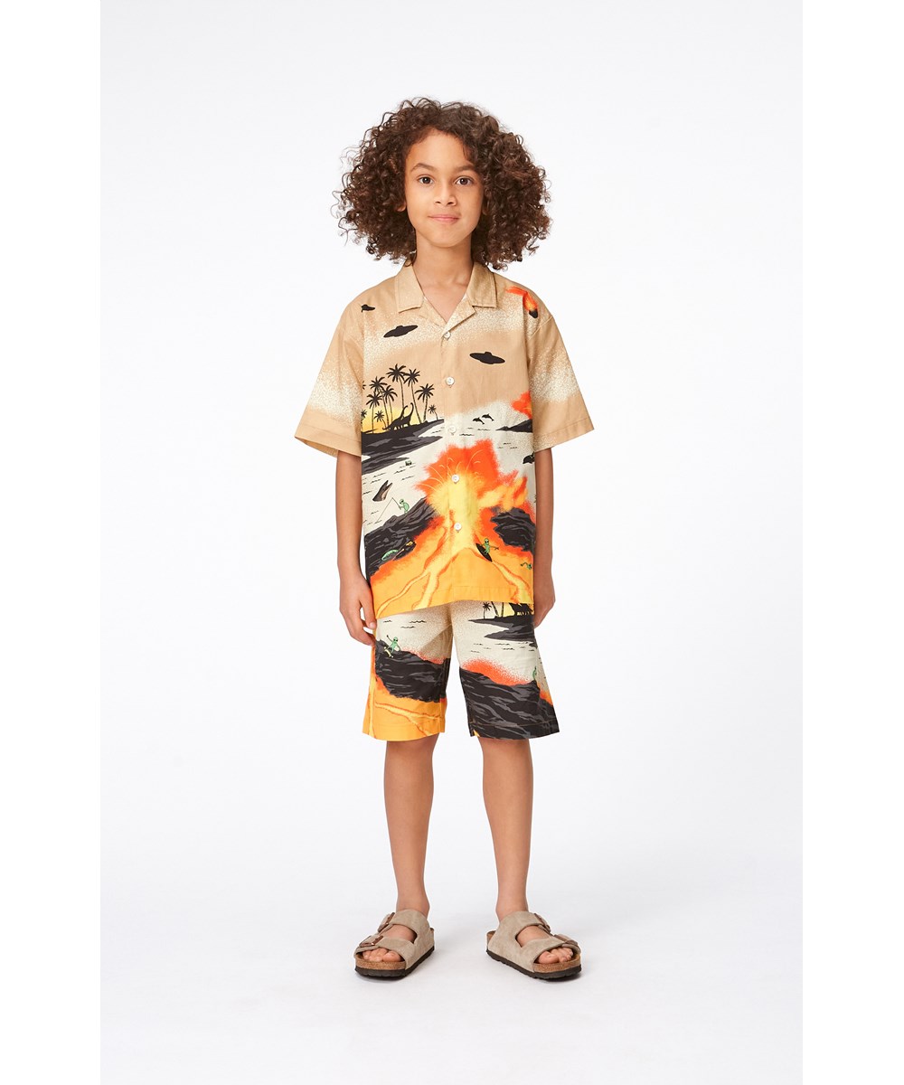 Adi - Alien Tourists - Yellow and sand coloured, organic shorts with alien surfer placement print