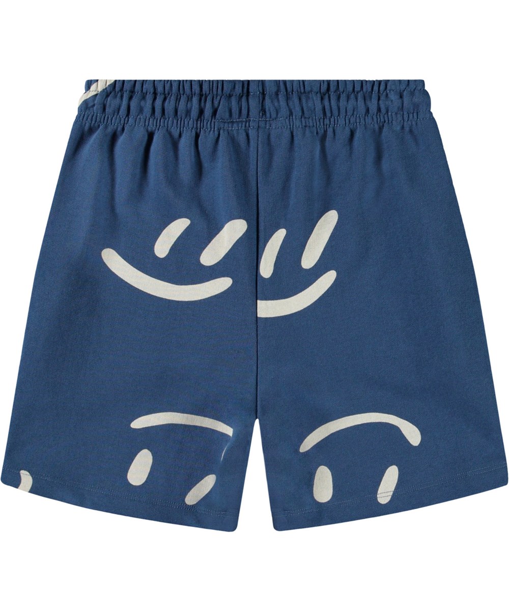 Amil - Big Smiles Blue - Shorts in organic cotton jersey in blue with a print of smiling faces for children.
