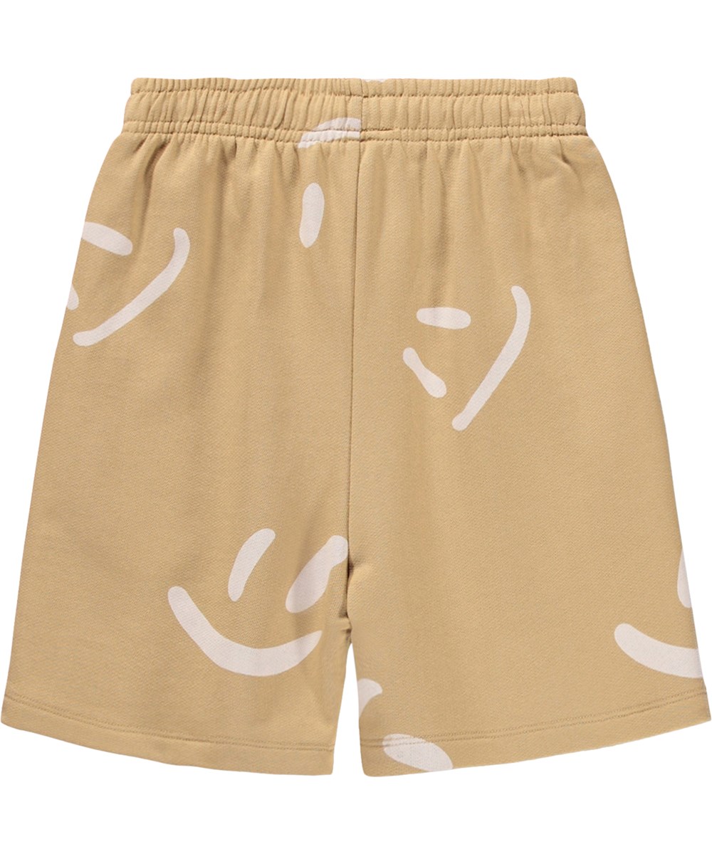 Amil - Desert Smiles - Beige shorts for children made of organic cotton jersey with a print 