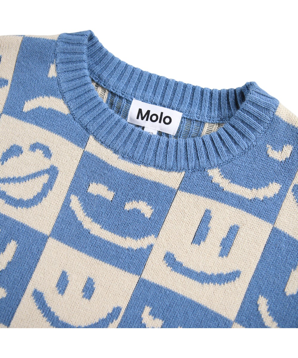 Bello - Moods Knit - Checked sweater made of a cotton and wool blend with a pattern of smiling faces in blue and white.