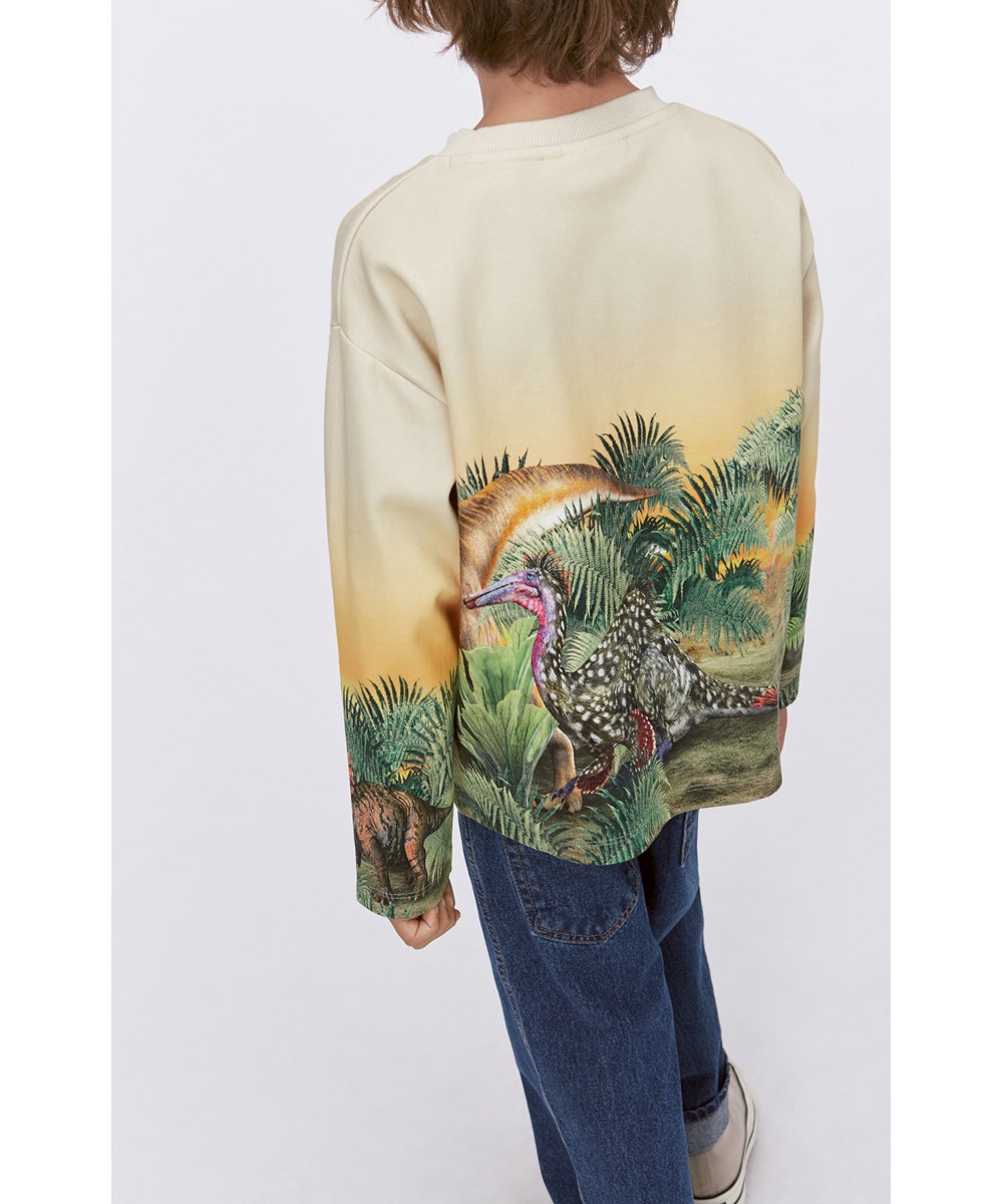 Monte -  Friendly Dinos - Yellow organic sweatshirt with placement dinosaur print