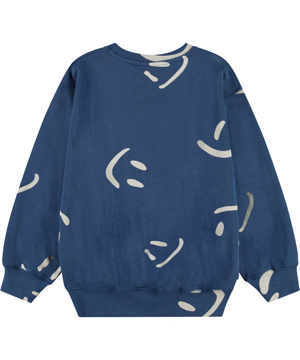 Monti - Big Smiles Blue - Dark blue sweatshirt with print for children in soft, organic cotton with ribbed edges at the neck, sleeves, and at the bottom of the sweatshirt.