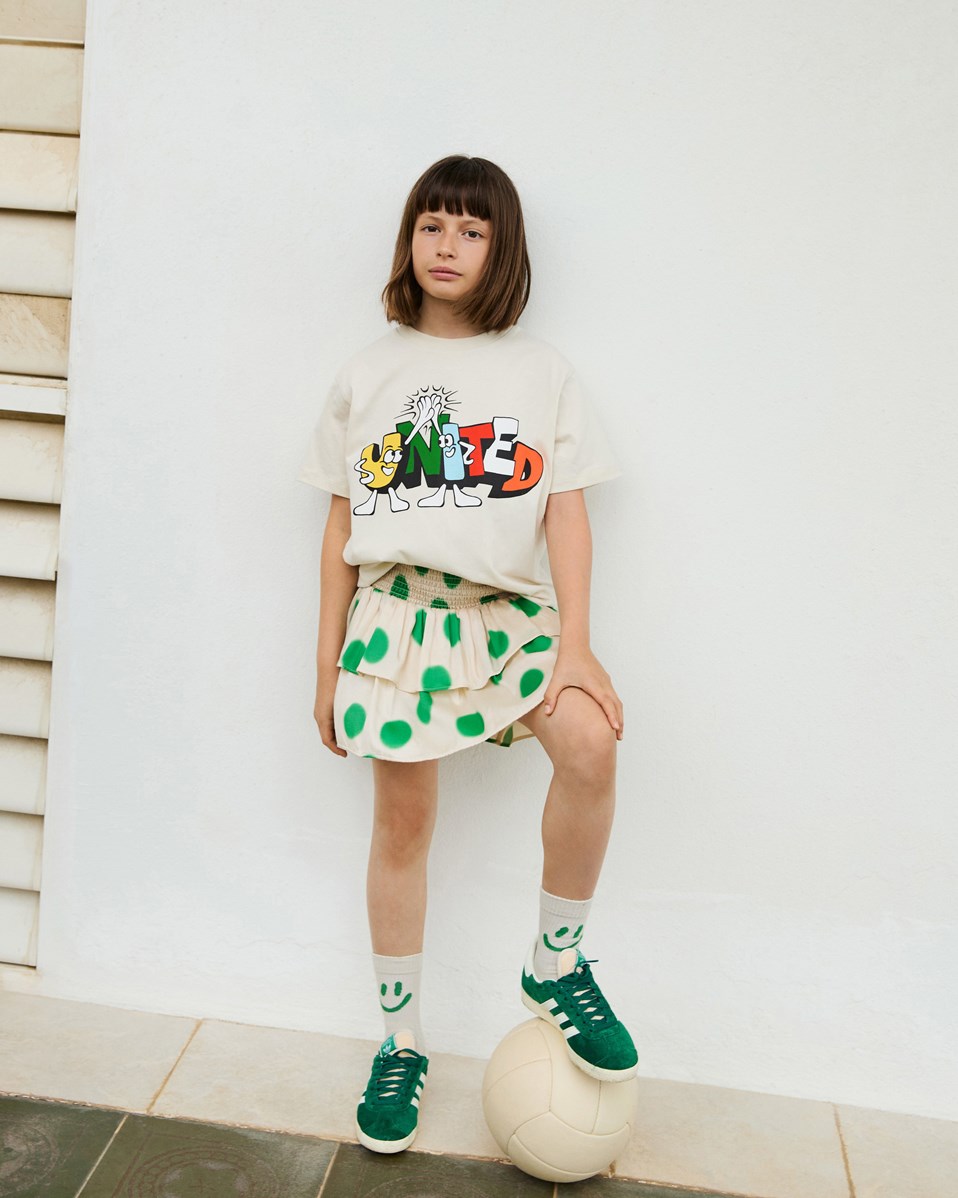 Rodney - United - Off-white t-shirt with print for children in organic cotton with short sleeves and ribbed neckline.