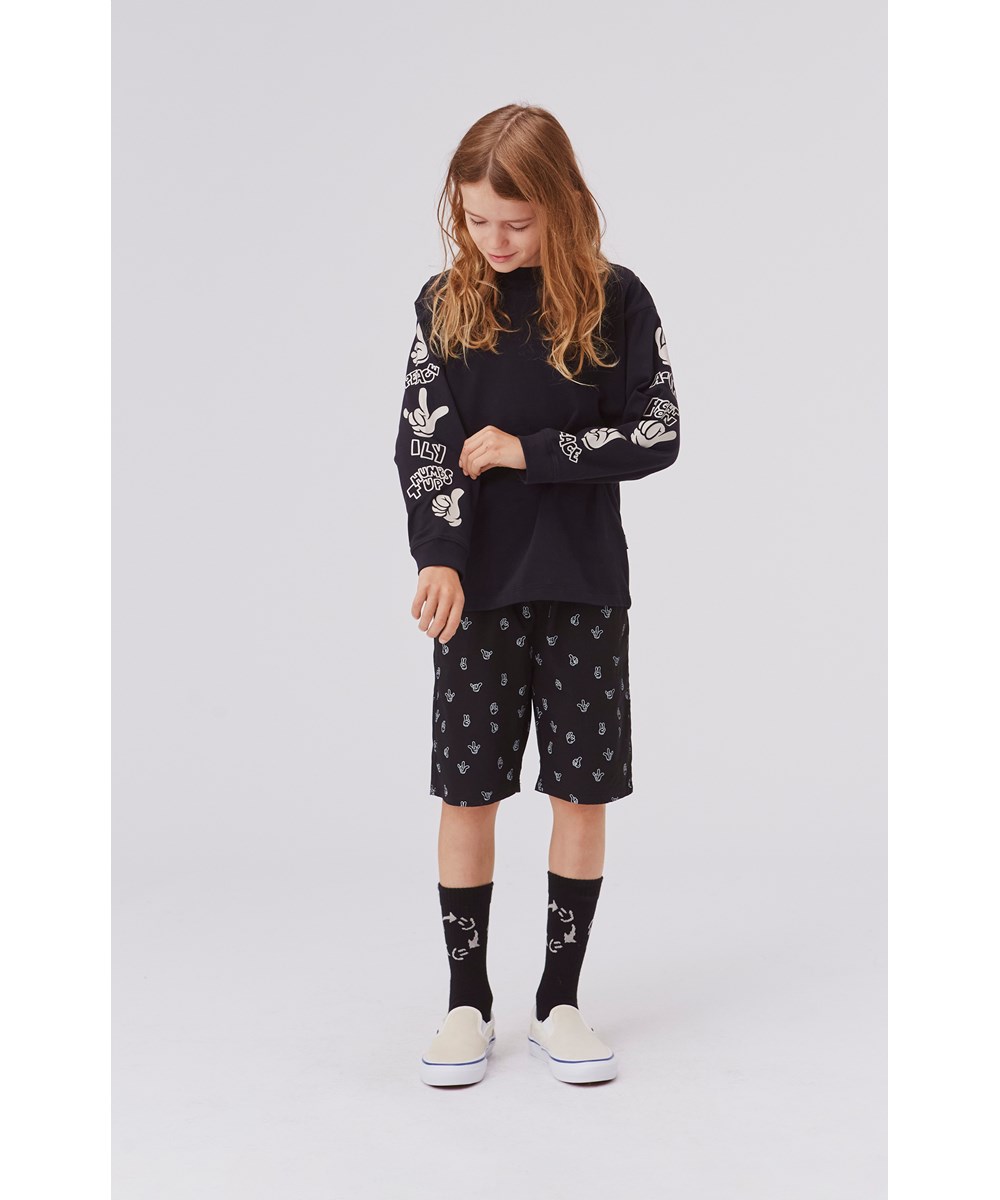 Avart - Friendly Hands - Sorte shorts med print af håndtegn