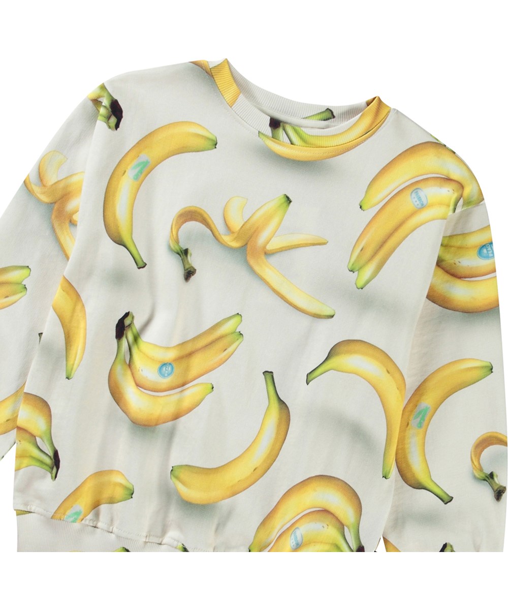 Mattis - Bananas - Beige sweatshirt med print til børn i blødt økologisk bomuld med ribkanter ved hals, ærmer og i bunden af blusen.