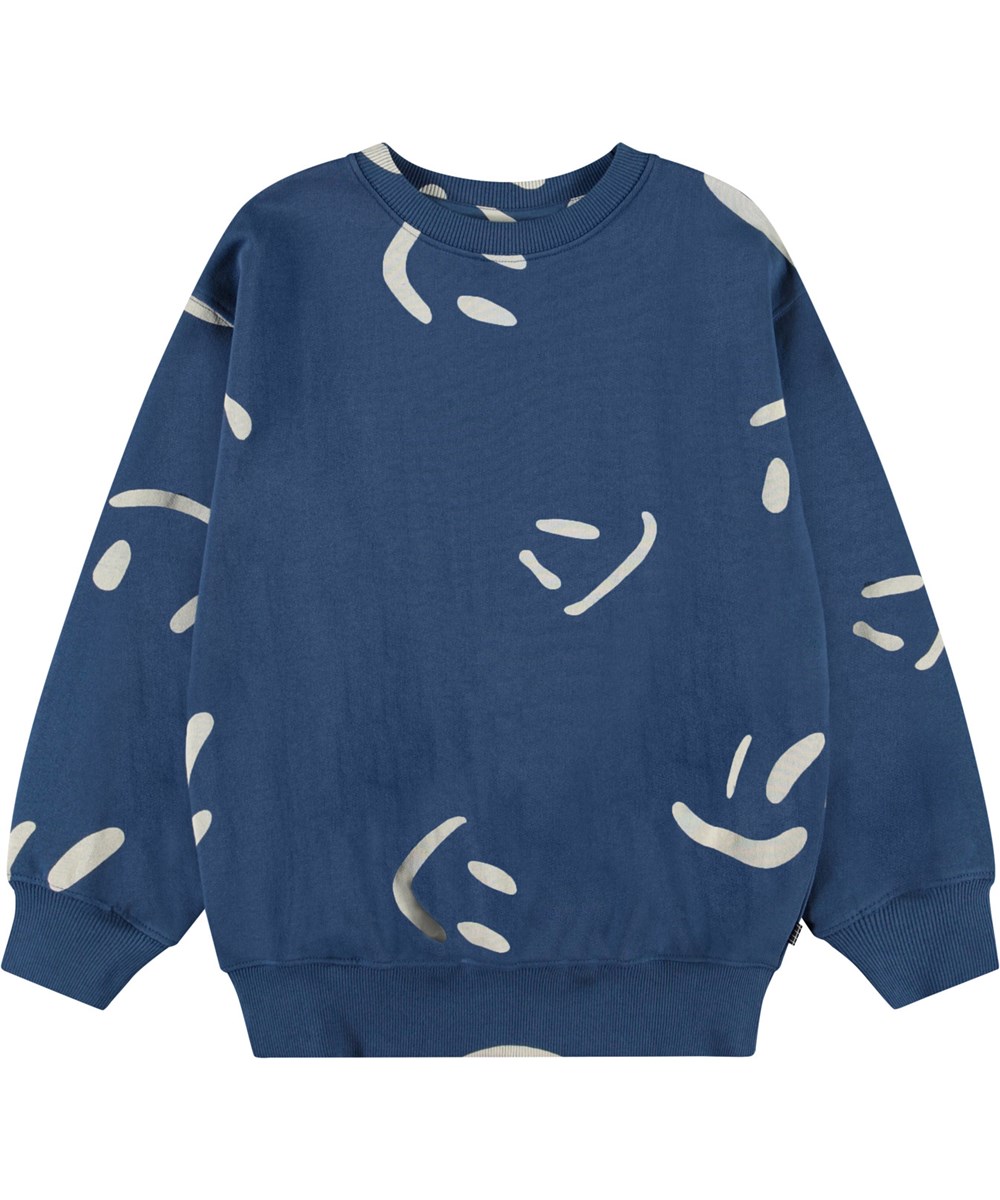 Monti - Big Smiles Blue - Mørkeblå sweatshirt med print til børn i blødt, økologisk bomuld med ribkanter ved hals, ærmer og i bunden af blusen.