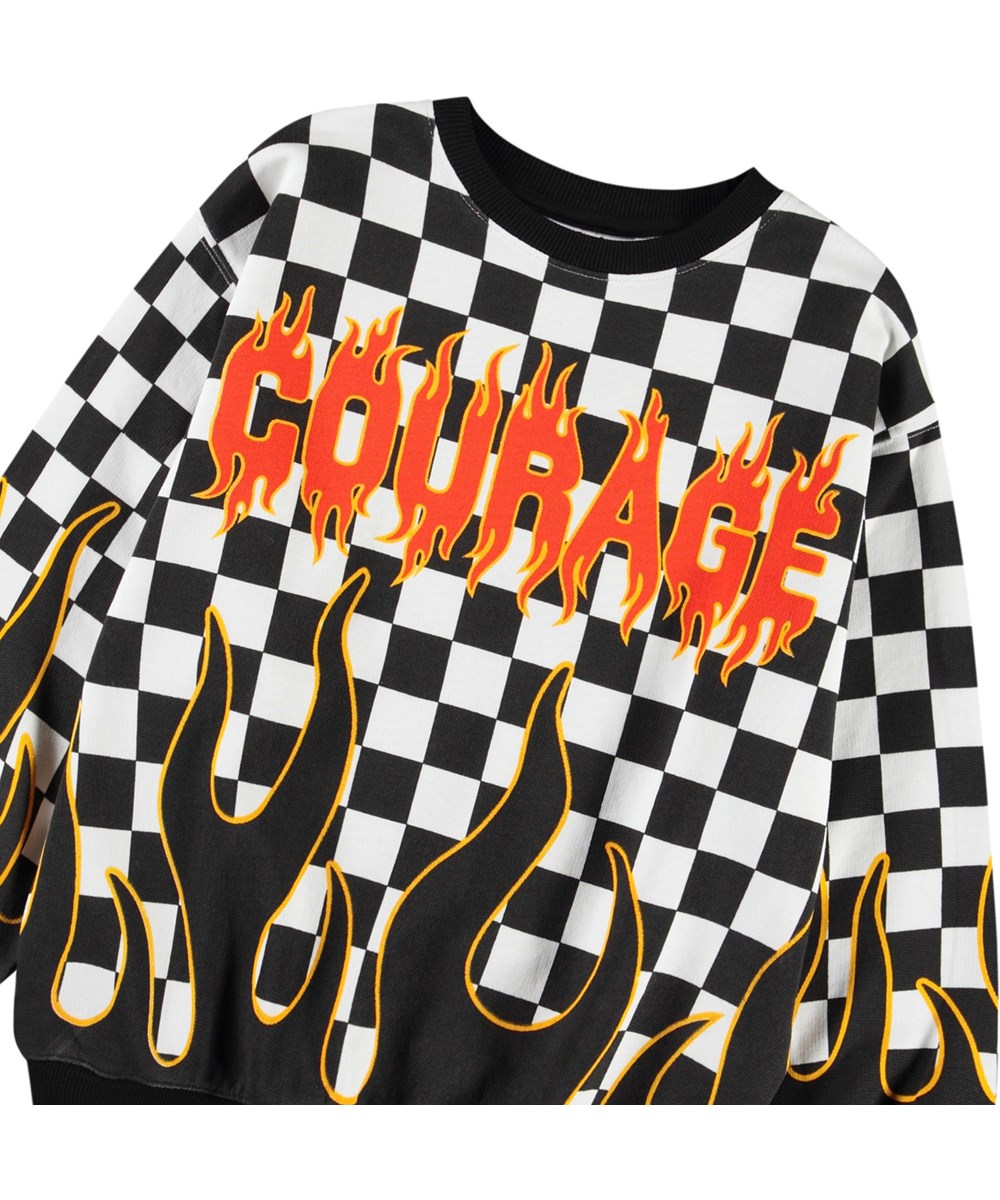 Monti - Check On Fire - Sort og hvidternet flammebluse sweatshirt med print til børn i blødt, økologisk bomuld med ribkanter ved hals, ærmer og i bunden af blusen.