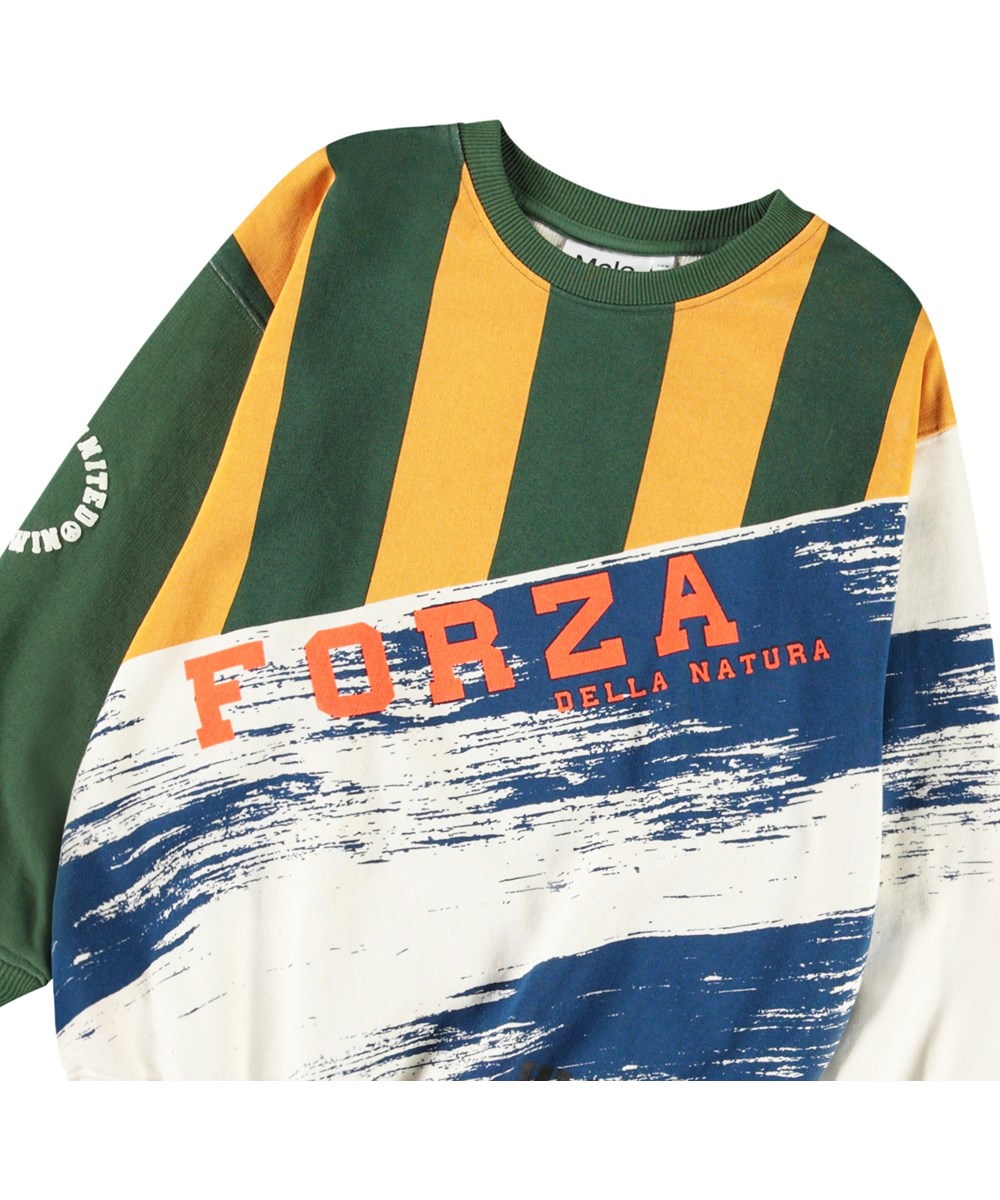 Monti - Mash Up - Multifarvet sweatshirt med print til børn i blødt, økologisk bomuld med ribkanter ved hals, ærmer og i bunden af blusen.