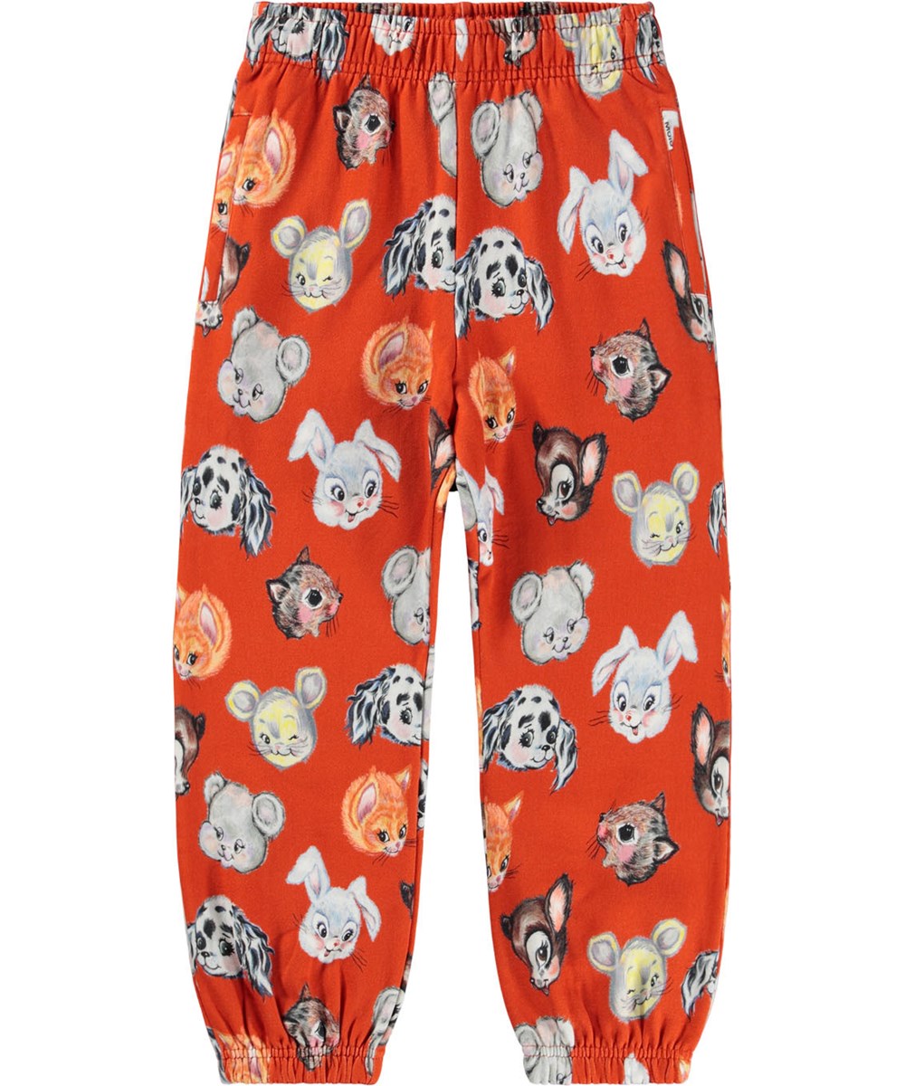 Adan - Rising Sun - Orangea sweatpants för barn tillverkade av ekologisk bomull med gulliga ritade djur.