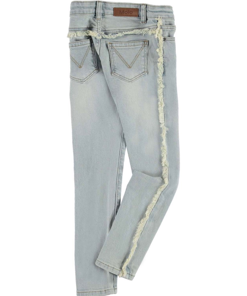 Adele - Light Tinted Blue - Slimfit jeans i ljusblå med fransar.