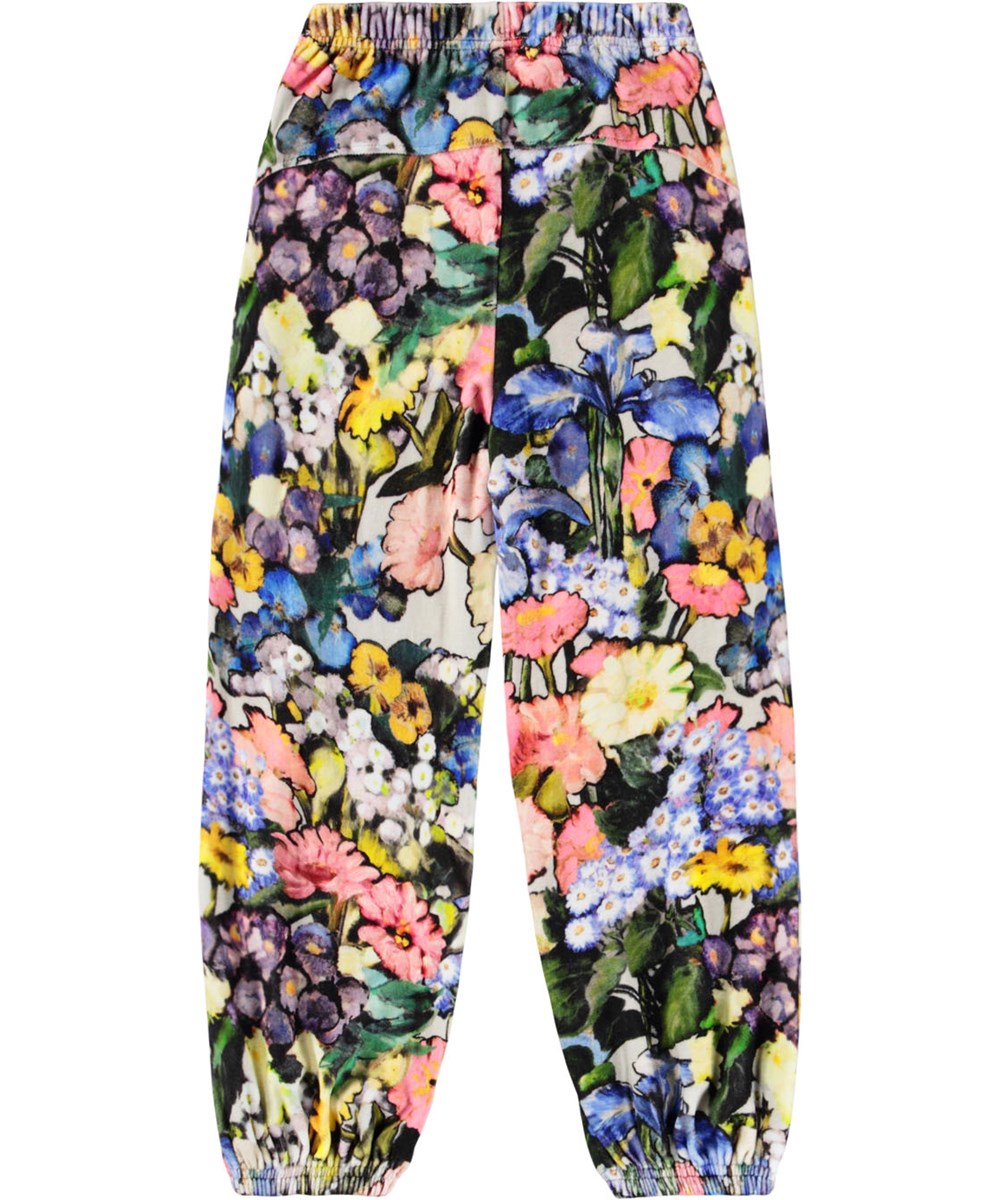 Adriana - Floral Impression - Multifärgade velourbyxor för barn tillverkade av mjuk bomull med blommigt mönster.