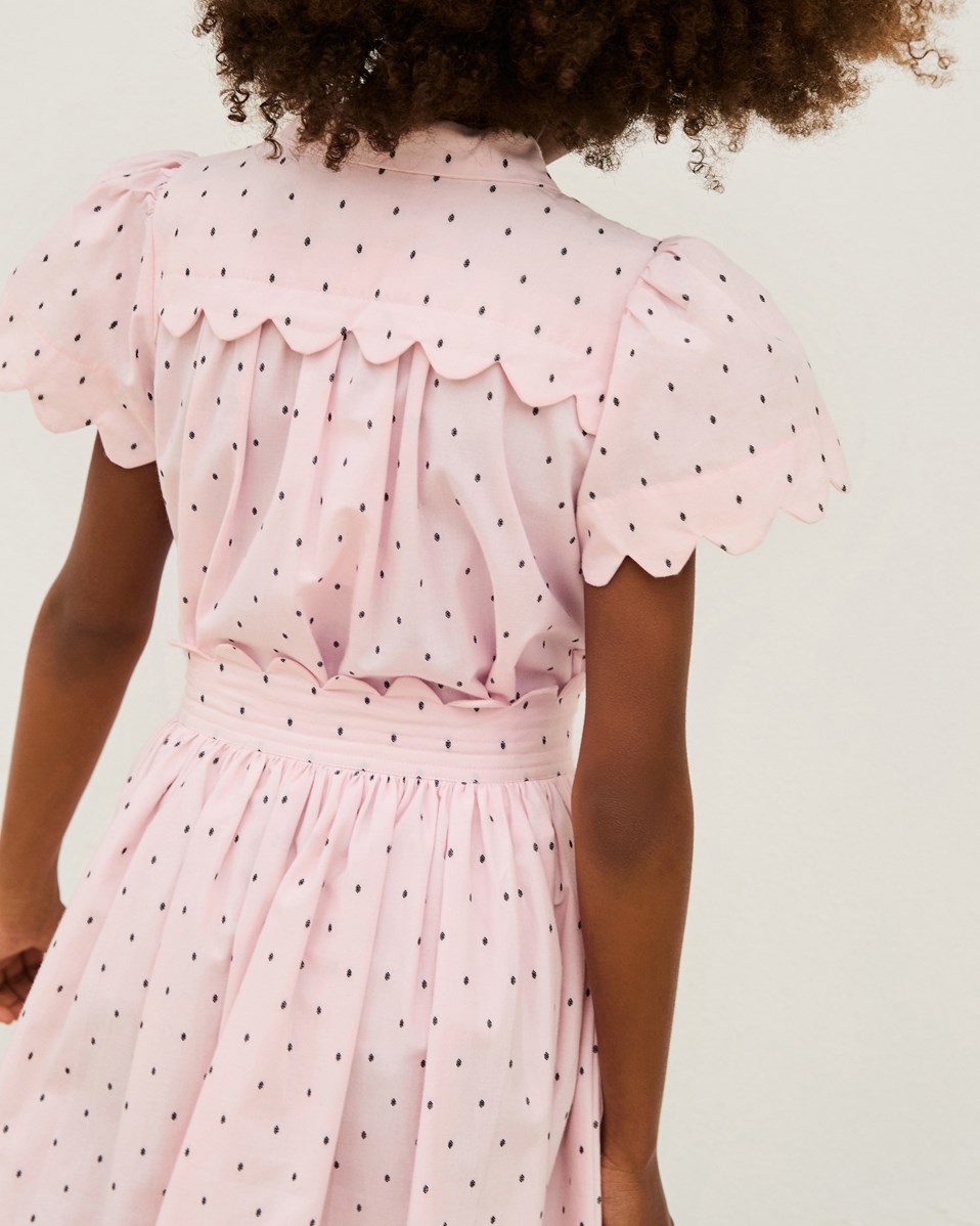 Bettina - Charlotte Pink - Rosa kjol för barn i ekologisk bomull, med vävda svarta prickar och delikata detaljer.