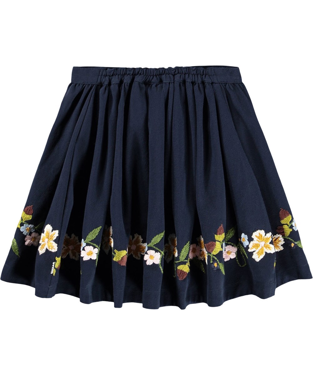 Bonnie - Galaxy Blue - Mörkblå kjol för barn gjord av bomullstwill med broderi av blommor och nötter.