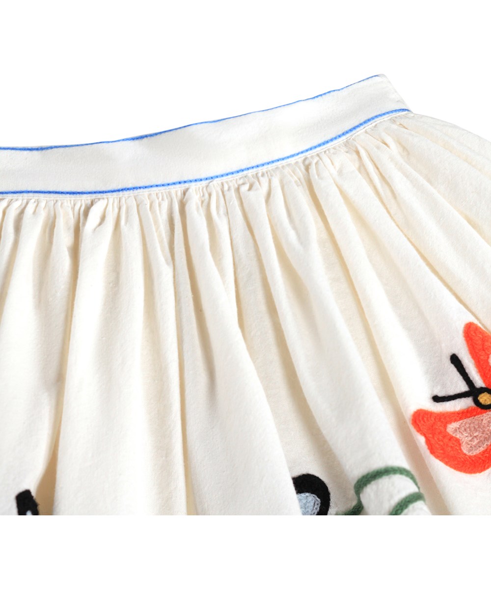 Bonnie - Nature Border - Knälång vit kjol för barn i ekologisk bomull med broderi