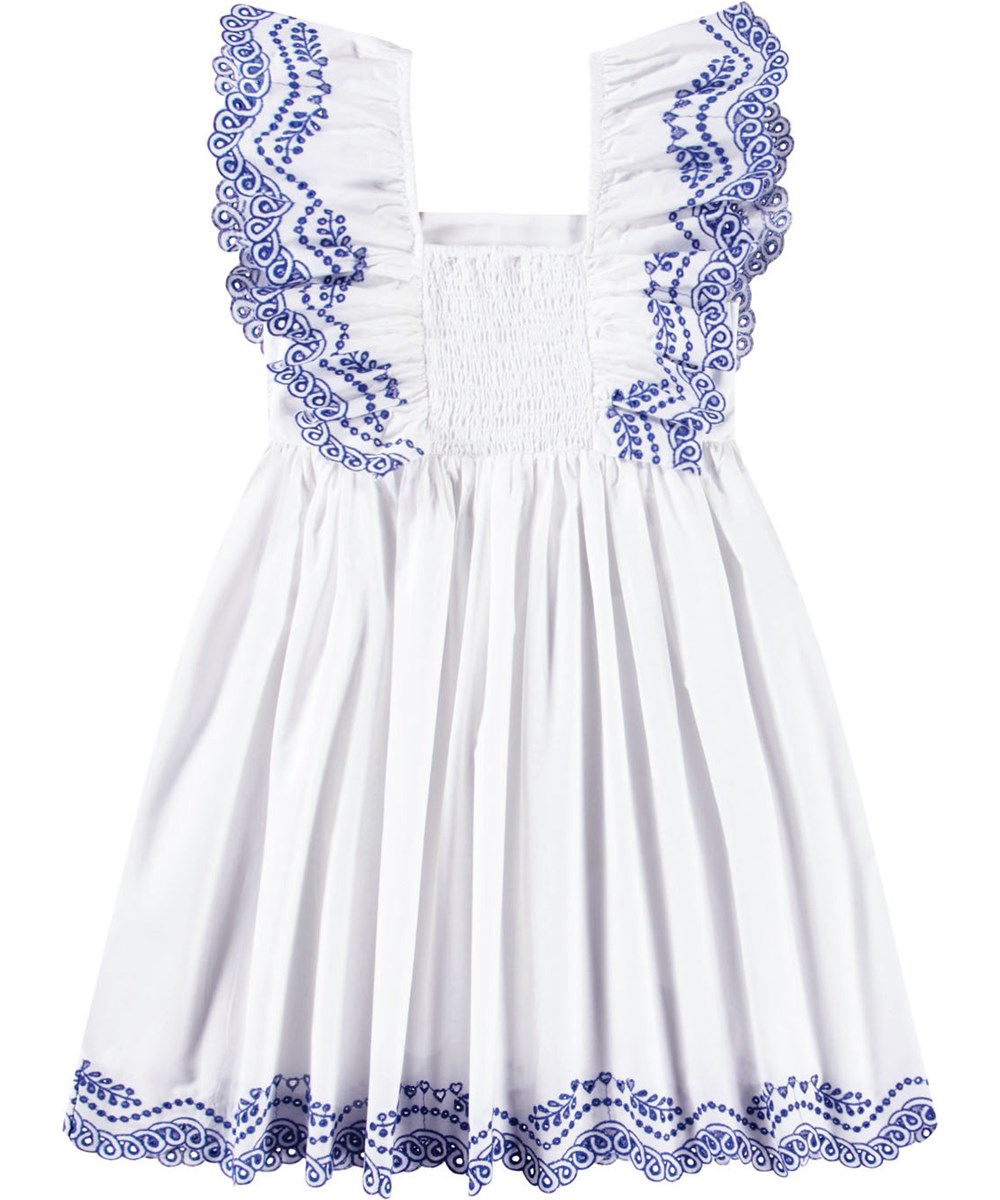 Clementine - Crisp White - Vit knälång klänning för barn i ekologisk bomull med broderie anglaise på kjolen och en volang över axeln.