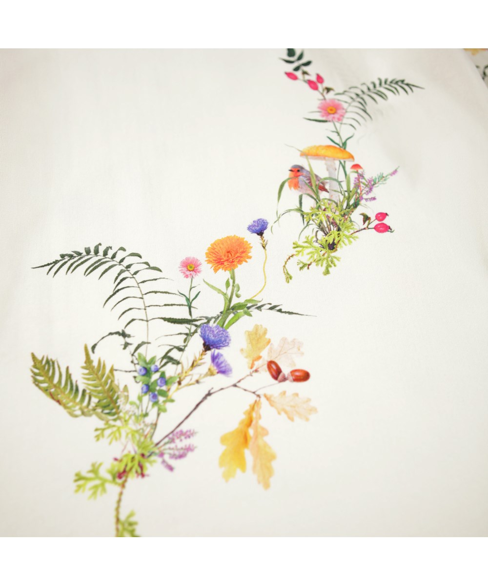 Cyrella - Forest Jewllery - Off-white sweatshirtklänning för barn gjord av ekologisk bomull med en hjort och blommor.
