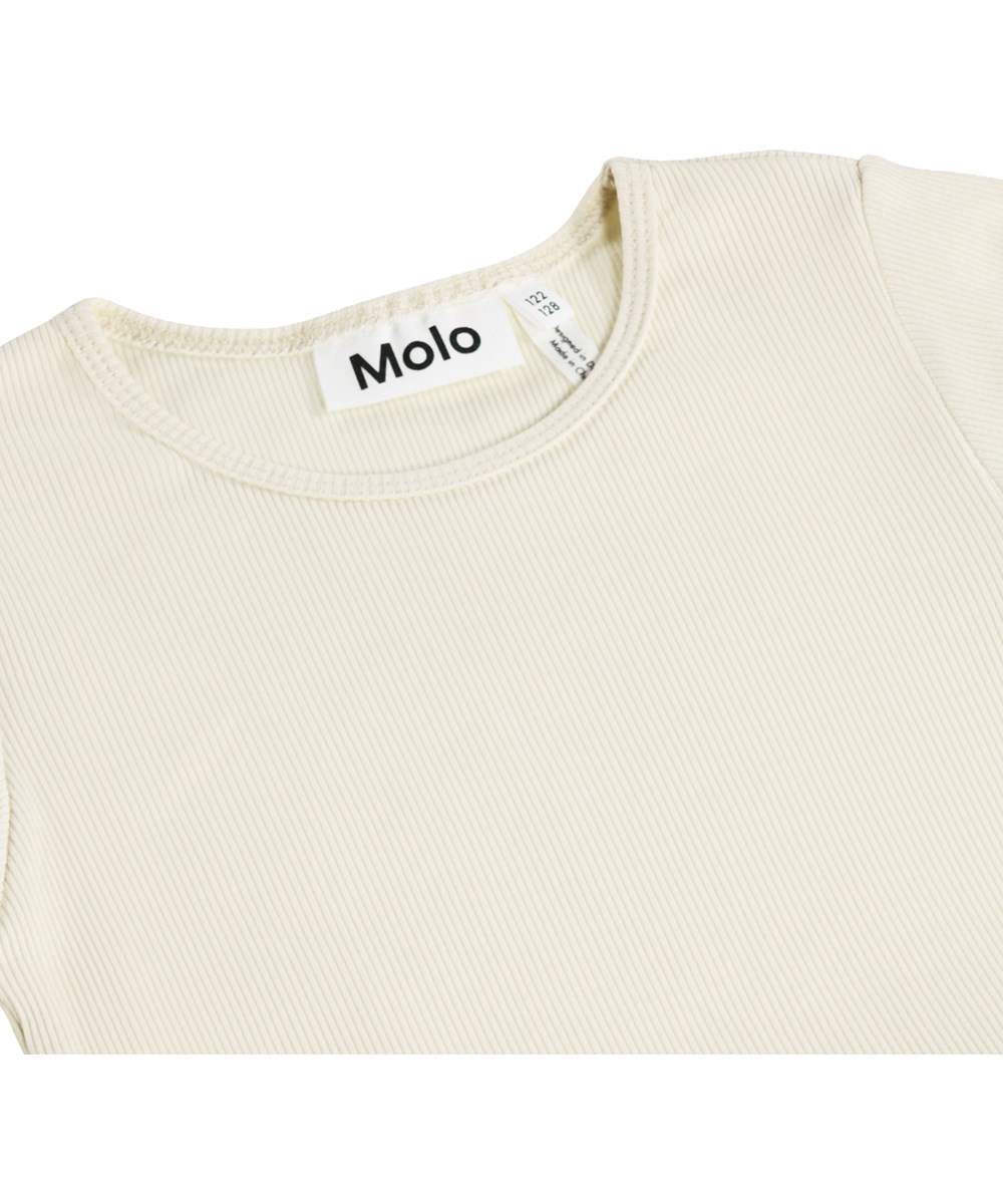 Cyrus - Summer Sand - Off-white klänning för barn med långa ärmar och en tyllkjol med glada paljettblommor