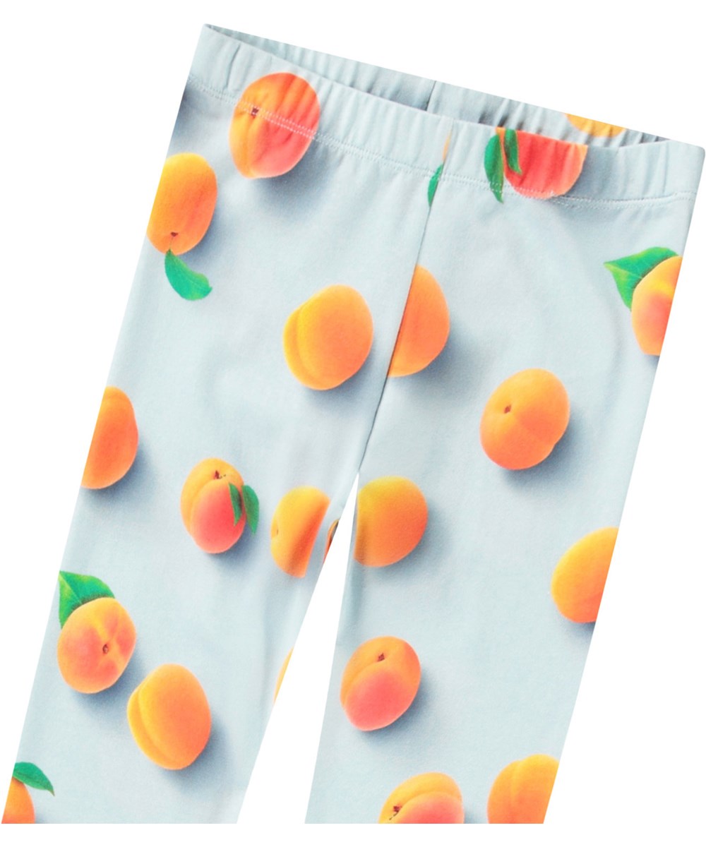 Niki - Fresh Apricots - Ljusblå leggings med tryck för barn i stretchig ekologisk bomull med resår i midjan.