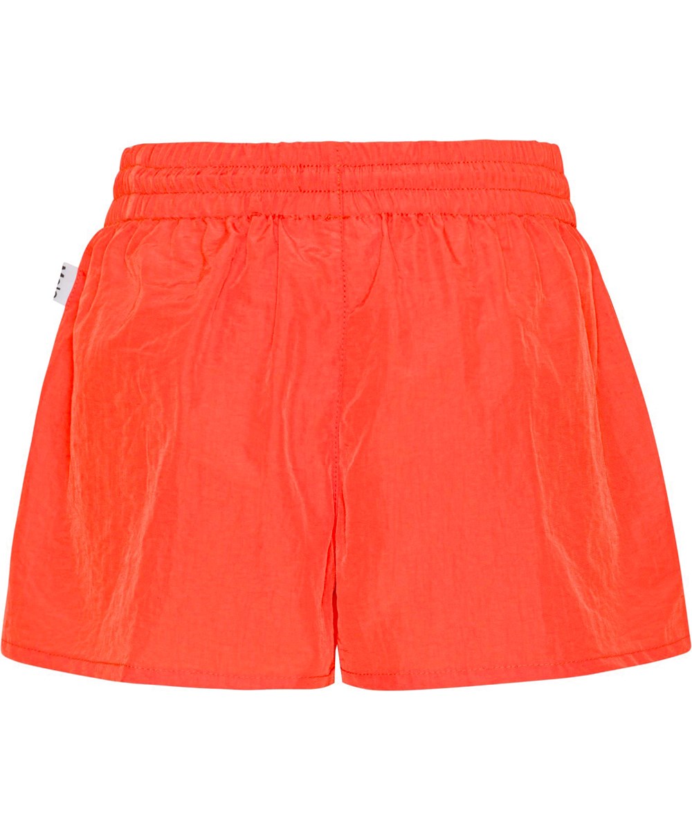 Addie - Red Clay - Röda sportiga nylonshorts med klöver logga. 