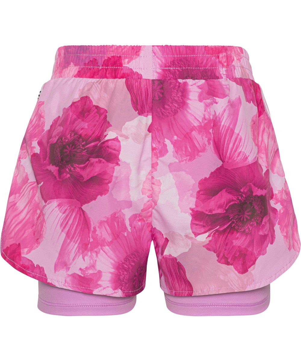 Omari - Dreamy Poppies - Tvådelade sportshorts med rosa blommor.