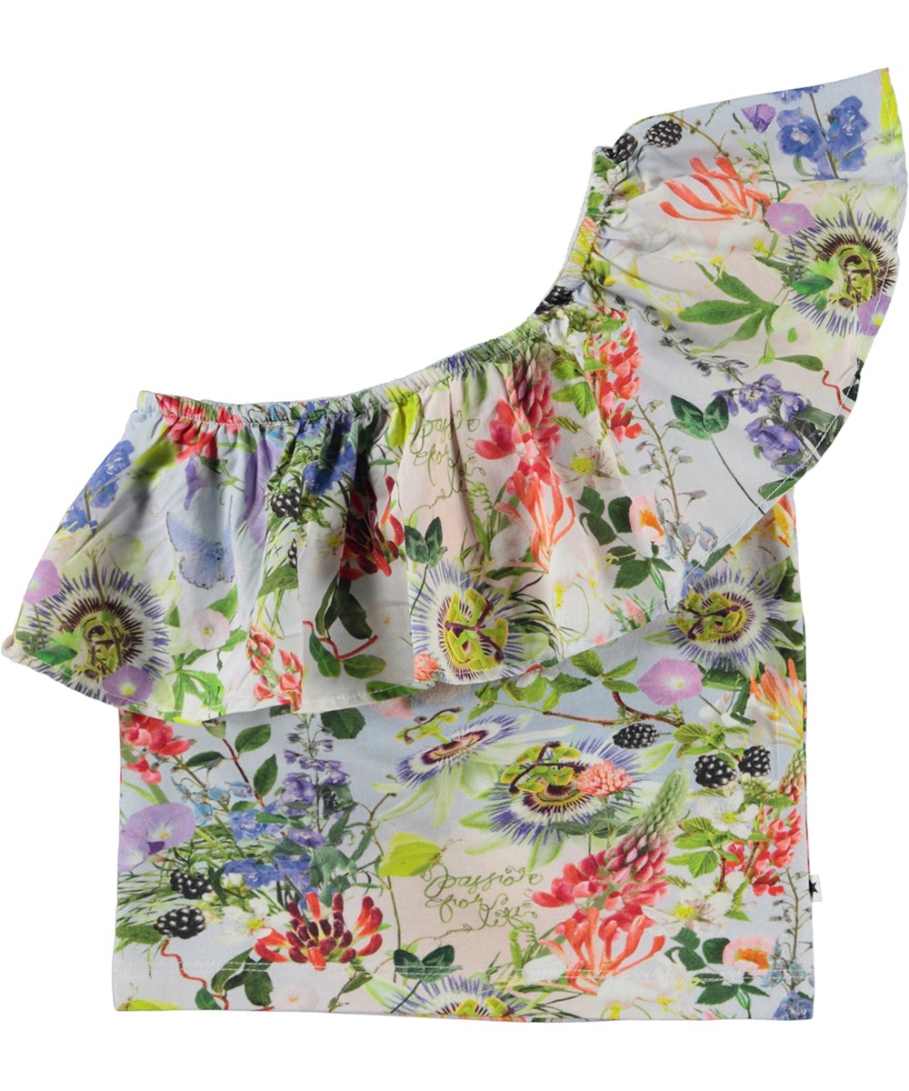 Raelyn - Passion For Life - Kort asymetrisk topp med volangkant oh blommor.